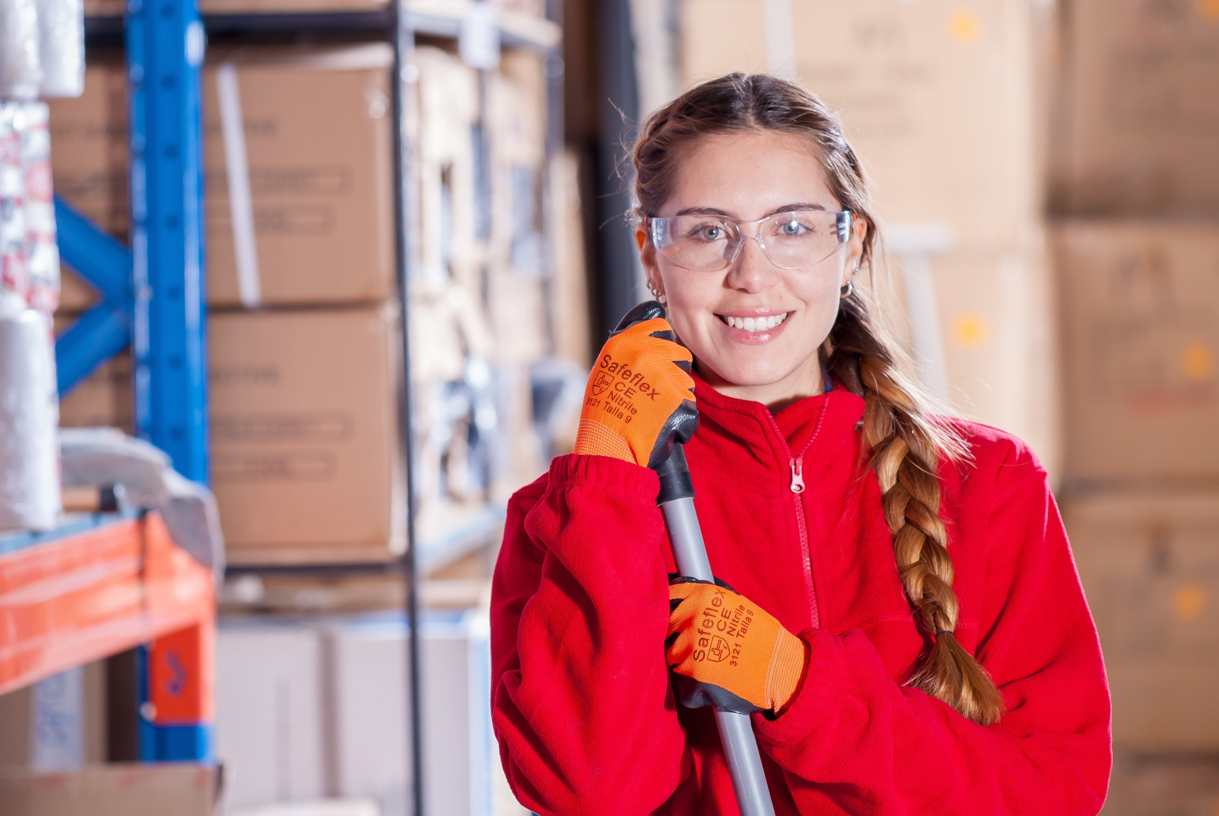 hairstyle, focus on foreground, cleaning, standing, holding, work clothes, adult, warehouse, woman, contemporary, one person, job, smile, front view, clothing, HD Wallpaper