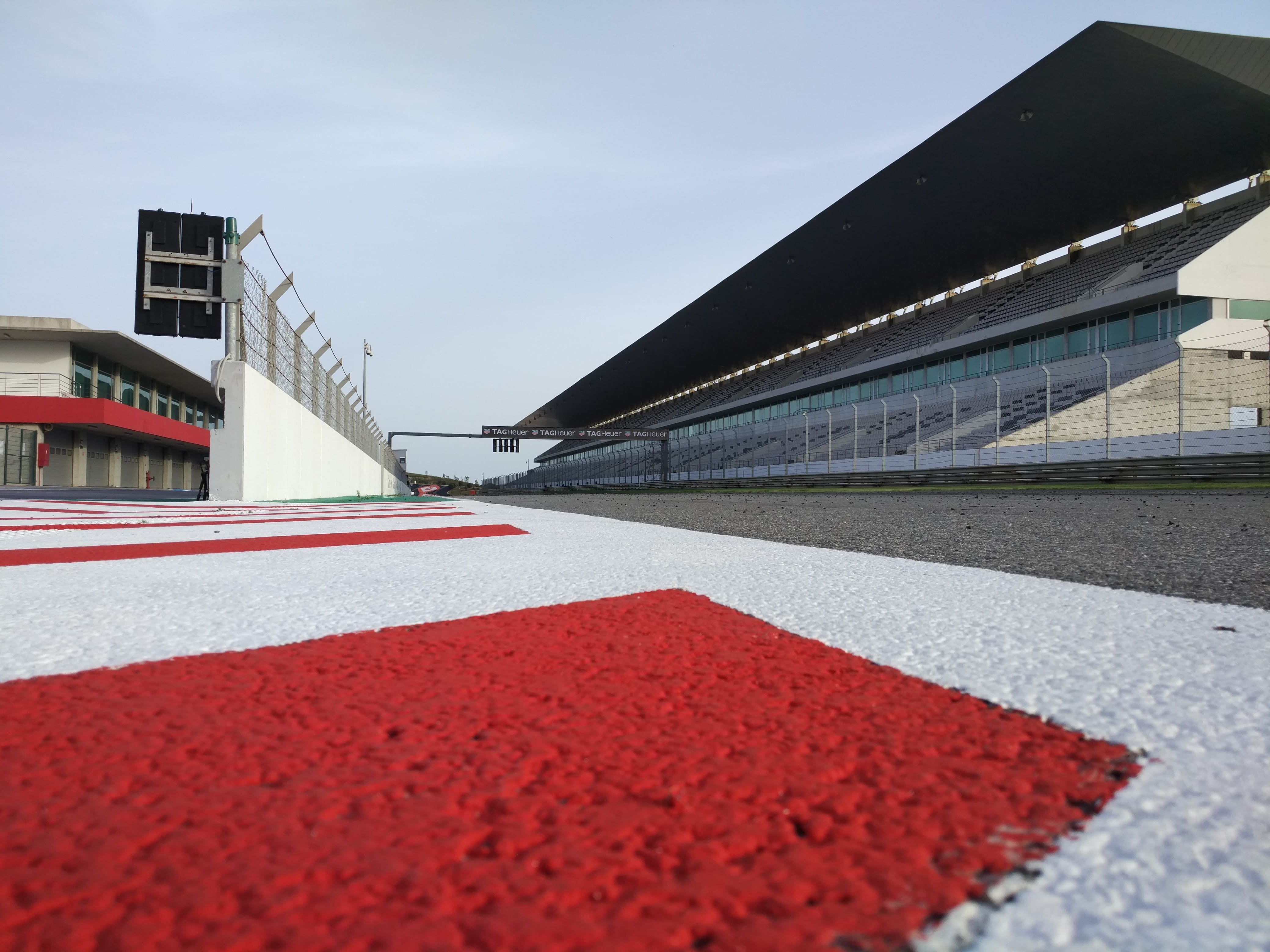 factory, transportation, asphalt, street, near, car, grandstand, race, no people, race track, way, university, building, red, speedway, sign, stadium, outdoors, HD Wallpaper