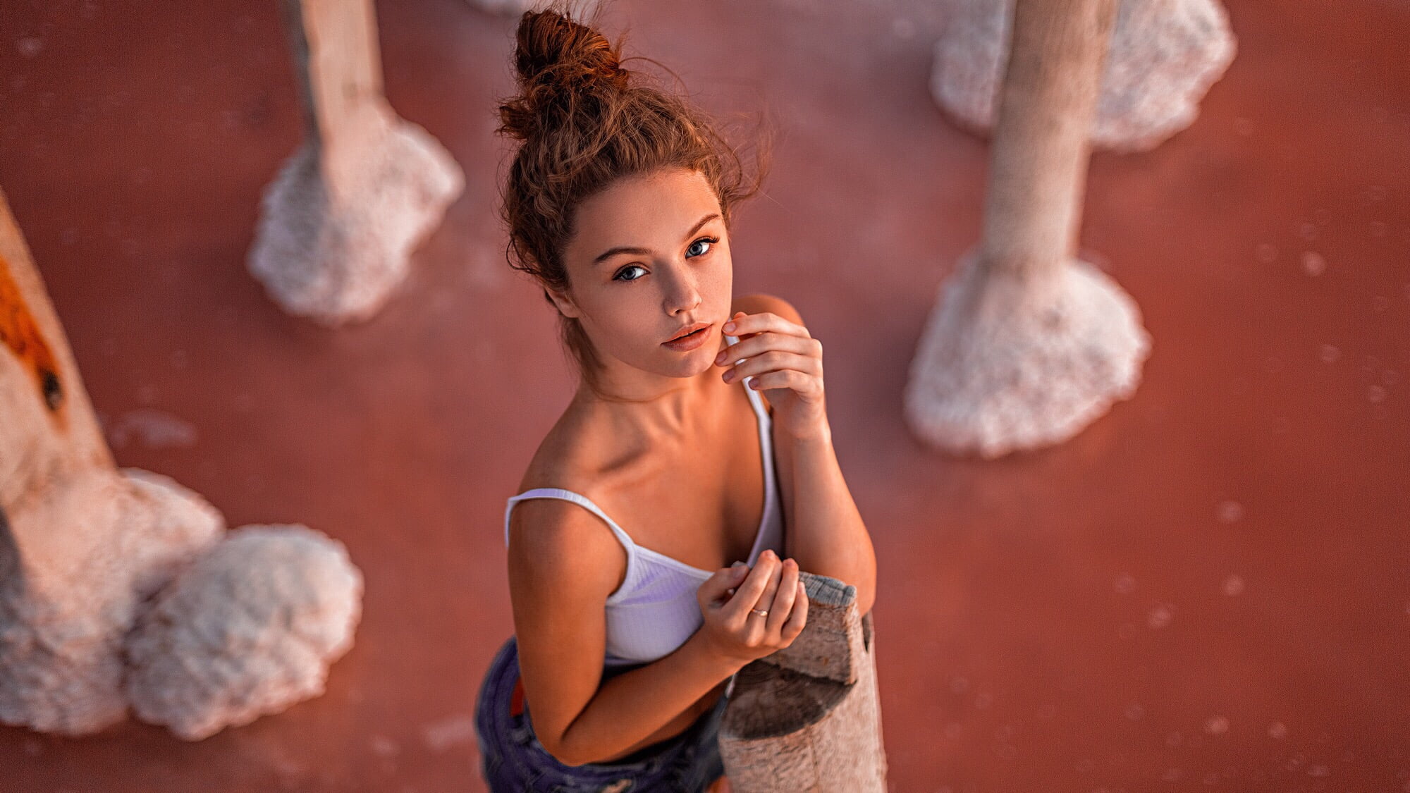 model, exercising, rock, brown hair, women outdoors, young women, cleavage, rock - object, hairbun, sport, young adult, women, 1080P, waist up, hairstyle, HD Wallpaper