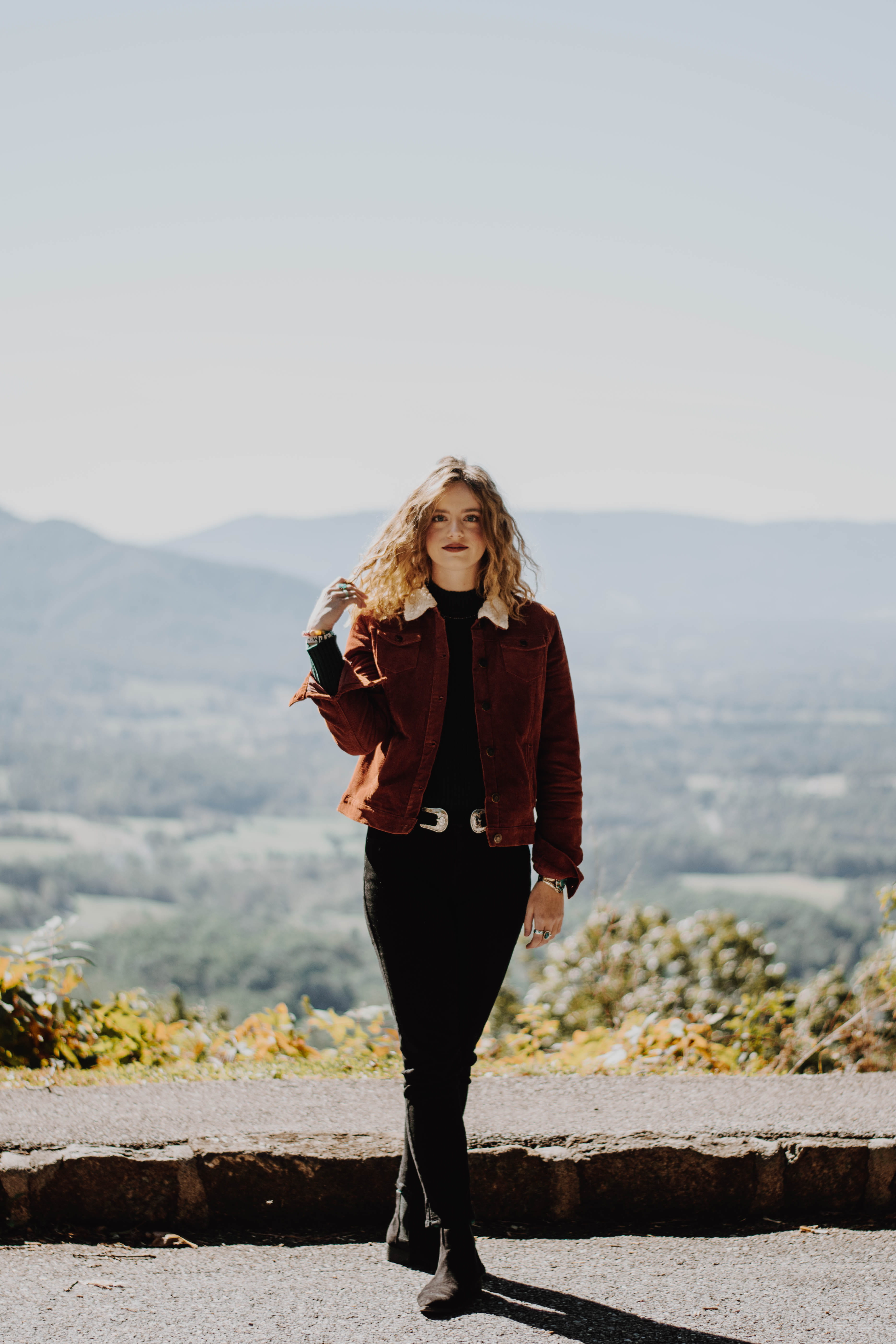 looking at camera, landscape, parkway, smile, happiness, warm clothing, one person, 5K, hair, full length, young adult, standing, mountain, female, beautiful woman, Phone HD Wallpaper