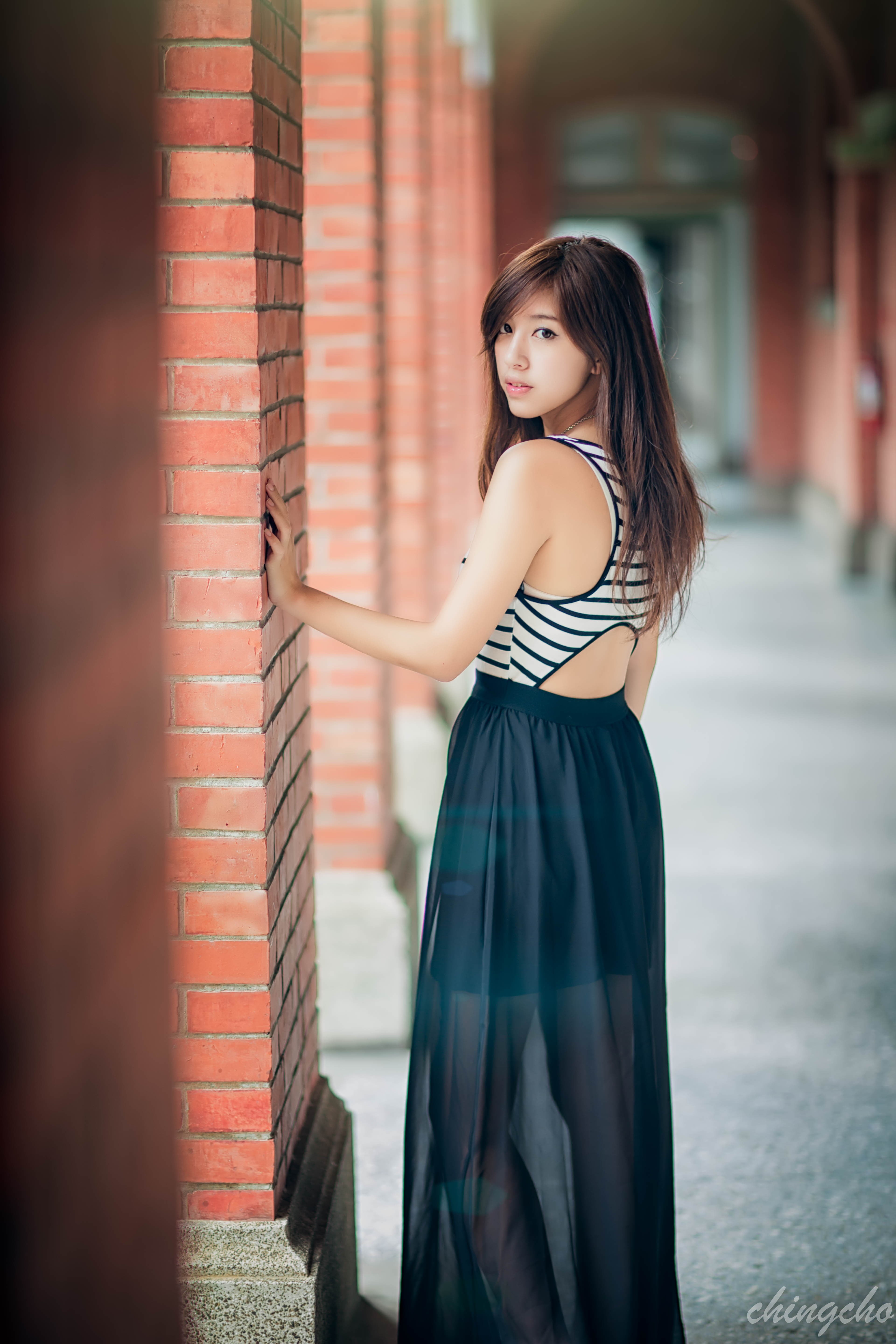 brick, beautiful woman, lifestyles, beauty, portrait, 5K, brunette, fashion, hair, smiling, looking back, eyeliner, Asian, one person, black skirts, long hair, Phone HD Wallpaper