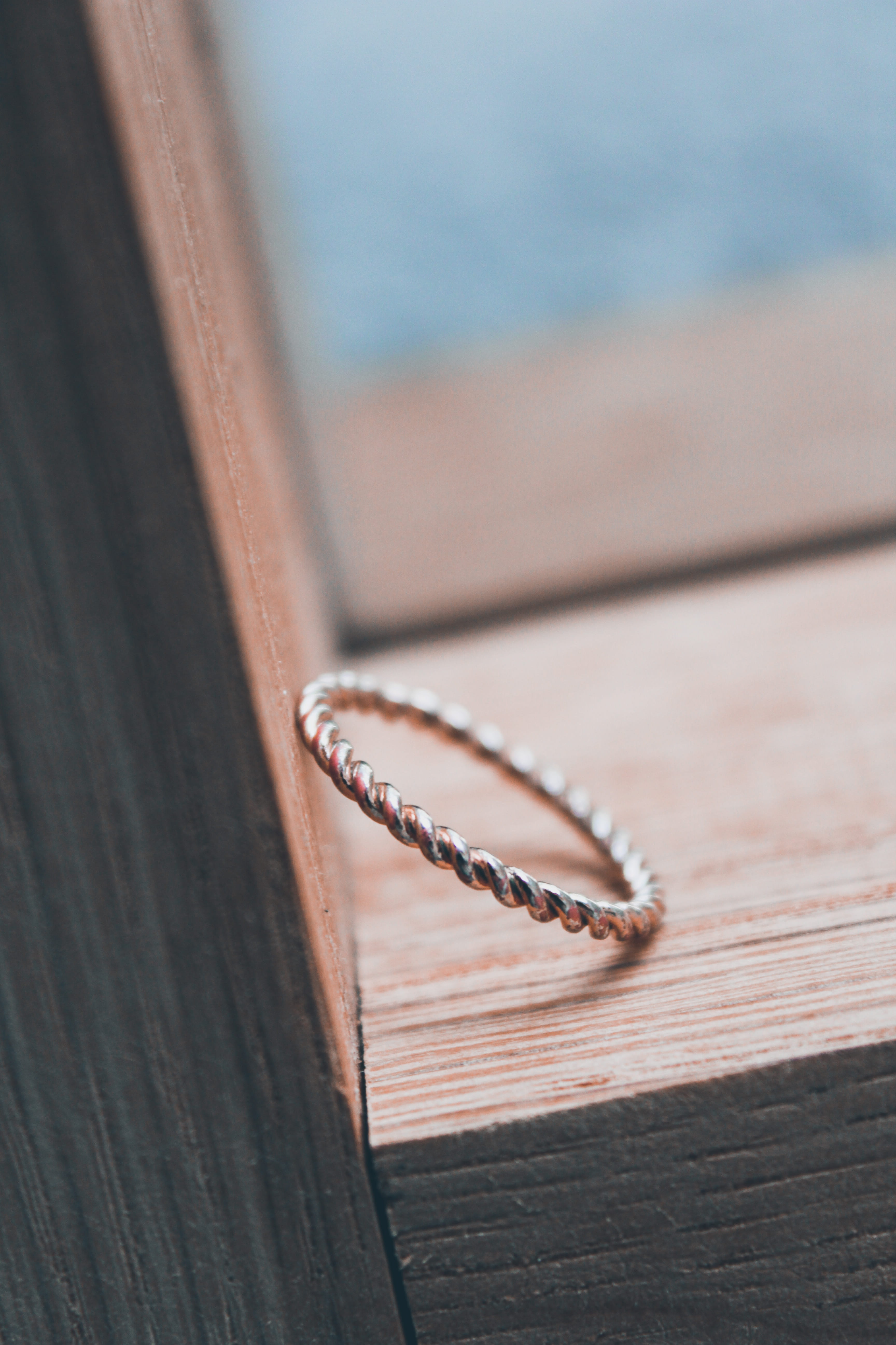 lens cap, day, metal, close-up, coil, emotion, open, hardwood, plant, focus on foreground, hacksaw, diary, 5K, table, jewelry, grain, plywood, selective focus, Phone HD Wallpaper