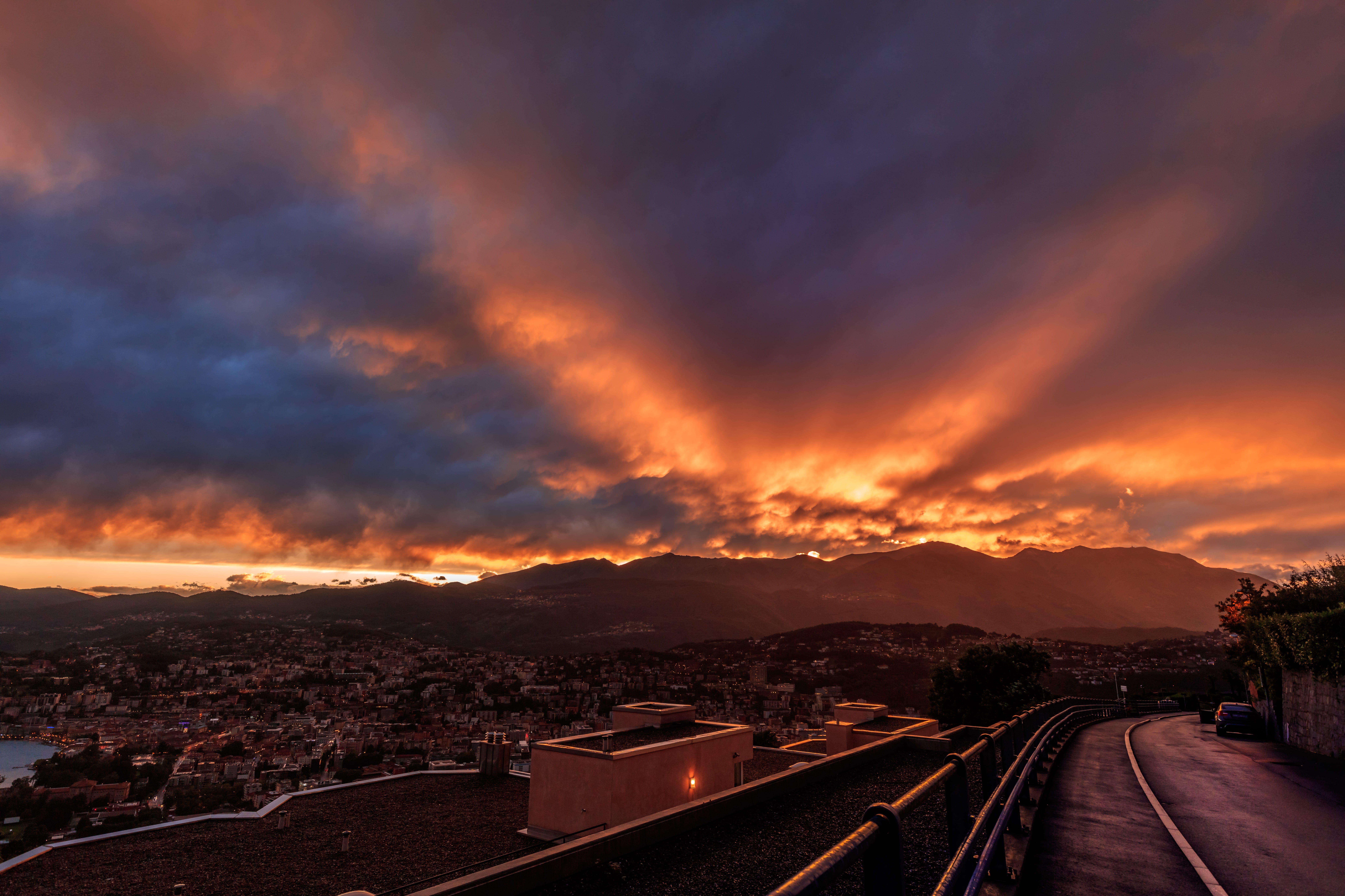 road, city, trees, mountain, blue, sunset, beauty in nature, street, orange, building exterior, the way forward, dramatic sky, transportation, cityscape, HD Wallpaper
