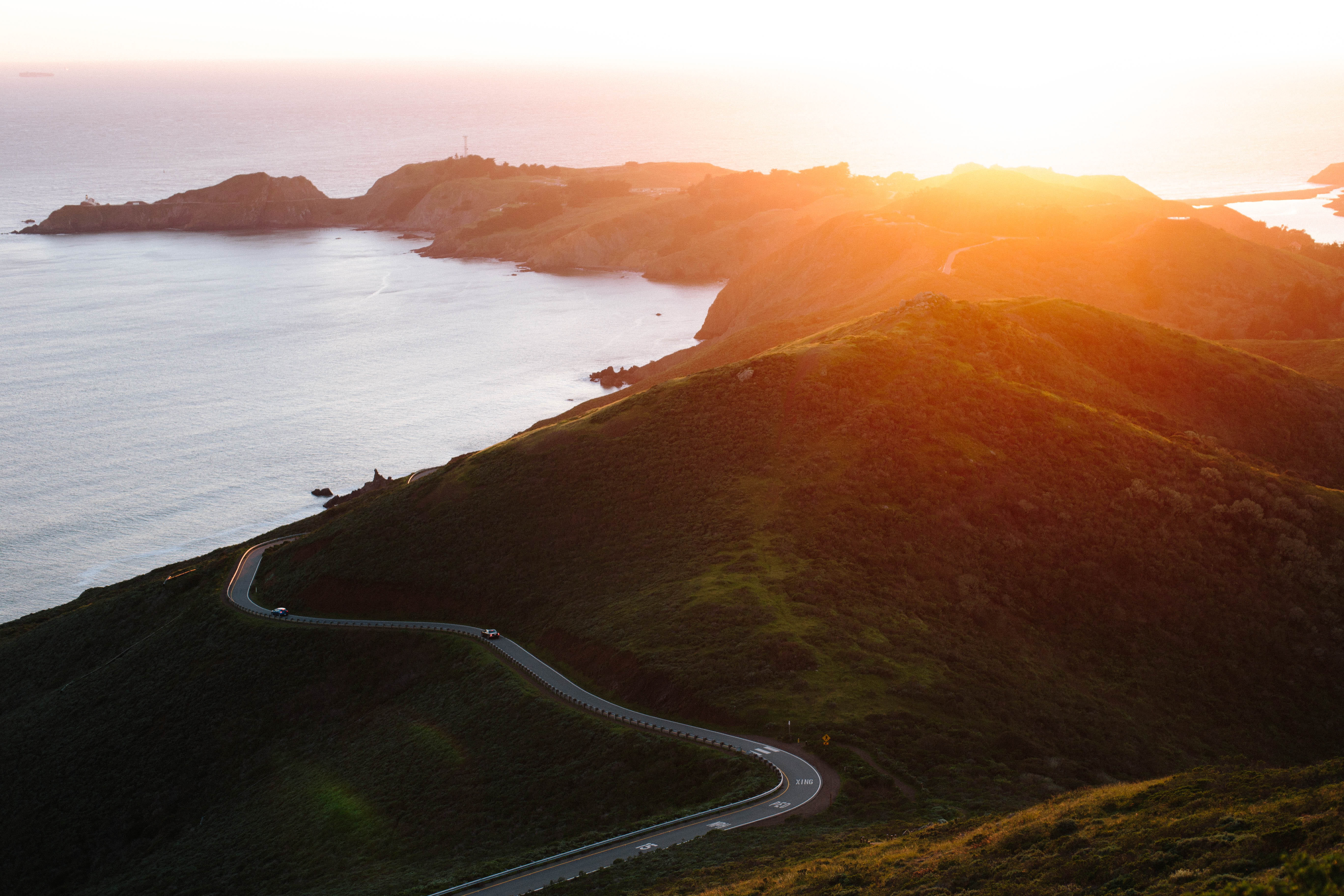 5K, road, sunlight, transportation, environment, ocean, highland, sunset, seaside, coastline, ridge, high angle view, non-urban scene, summit, water, beauty in nature, HD Wallpaper