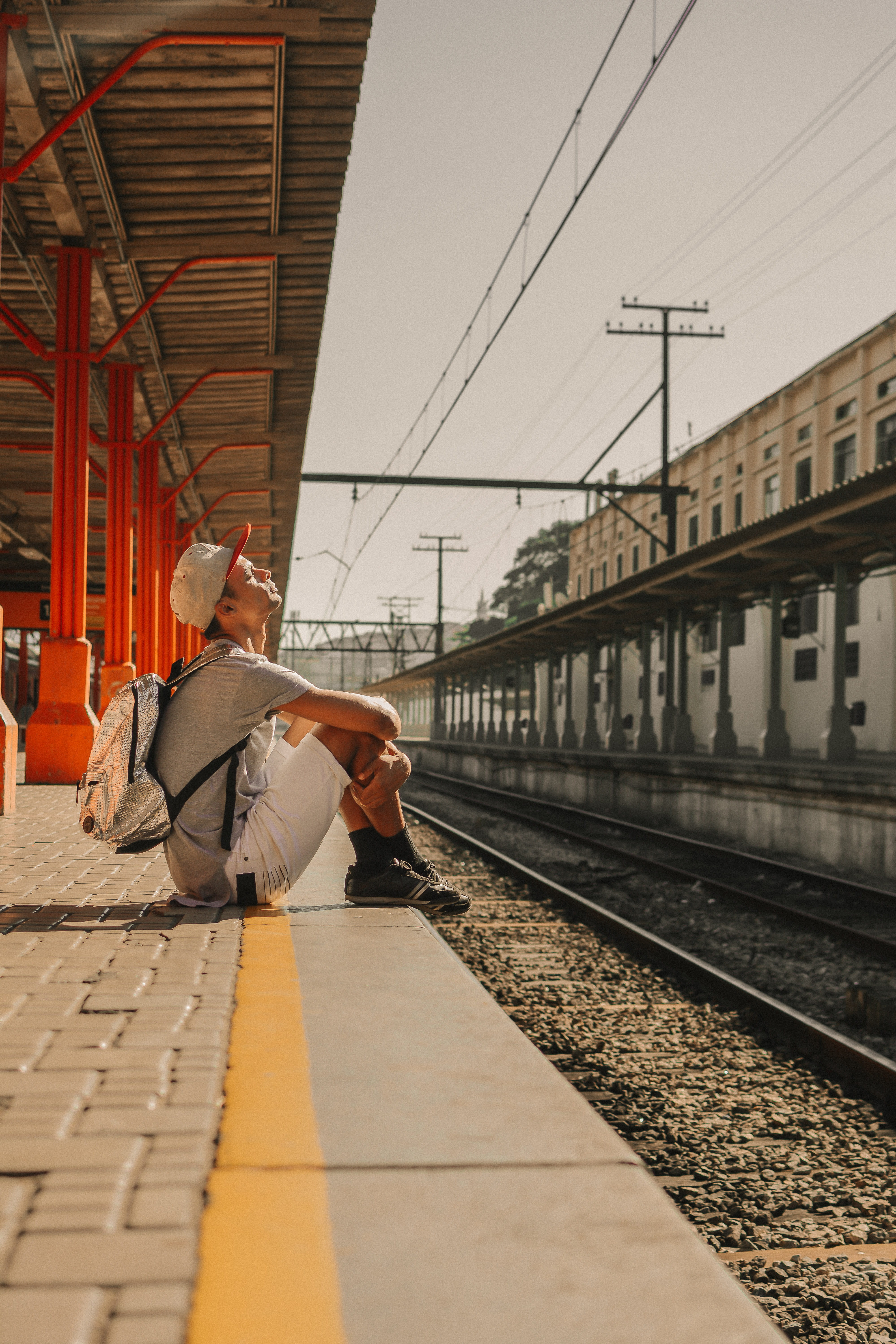one person, full length, cable, 5K, sunlight, man, rail transportation, track, person, temple, real people, adult, mode of transportation, lifestyles, Phone HD Wallpaper
