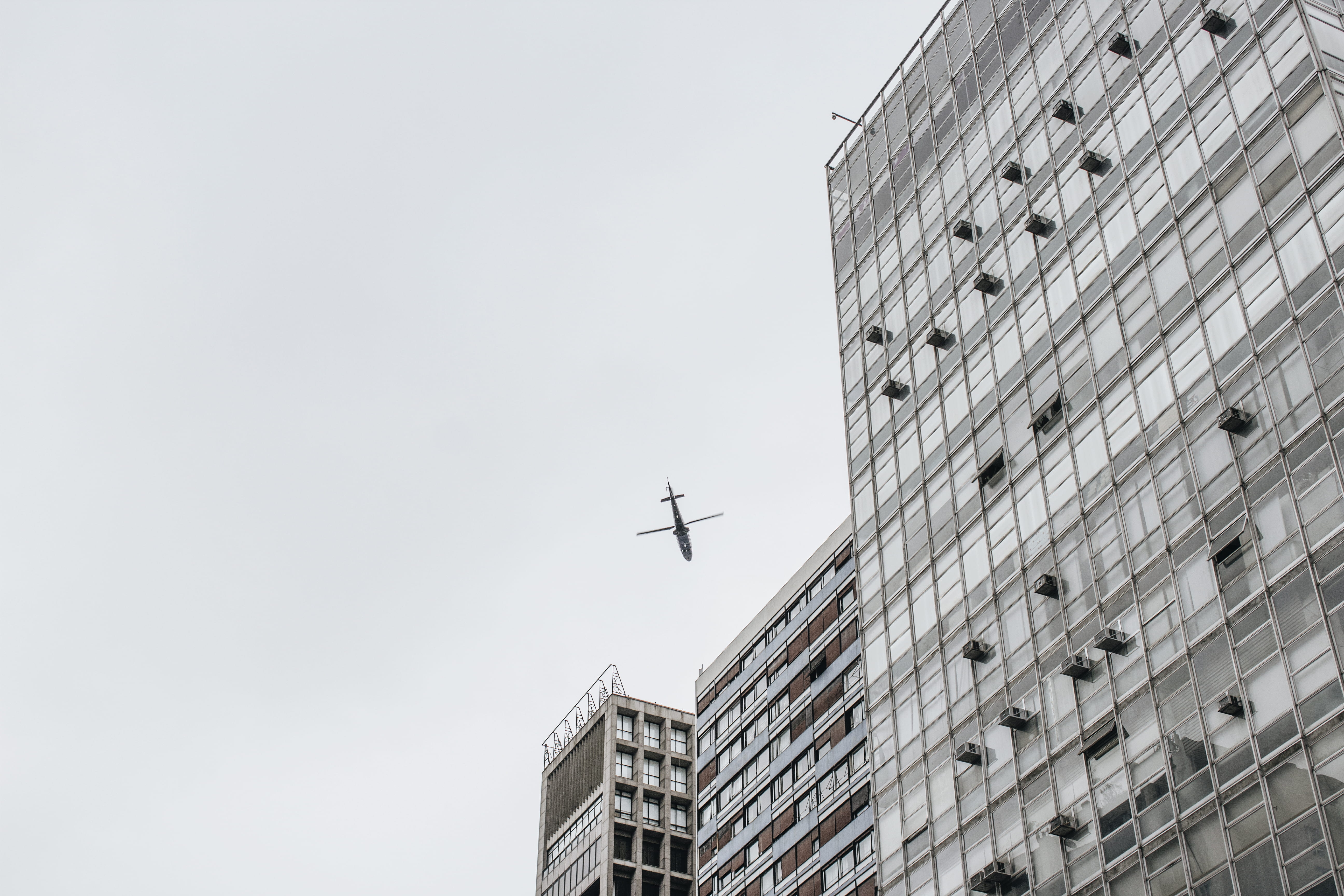 building exterior, architecture, day, skyscraper, building, high, no people, outdoors, airplane, near, 5K, flying, photography, mode of transportation, HD Wallpaper