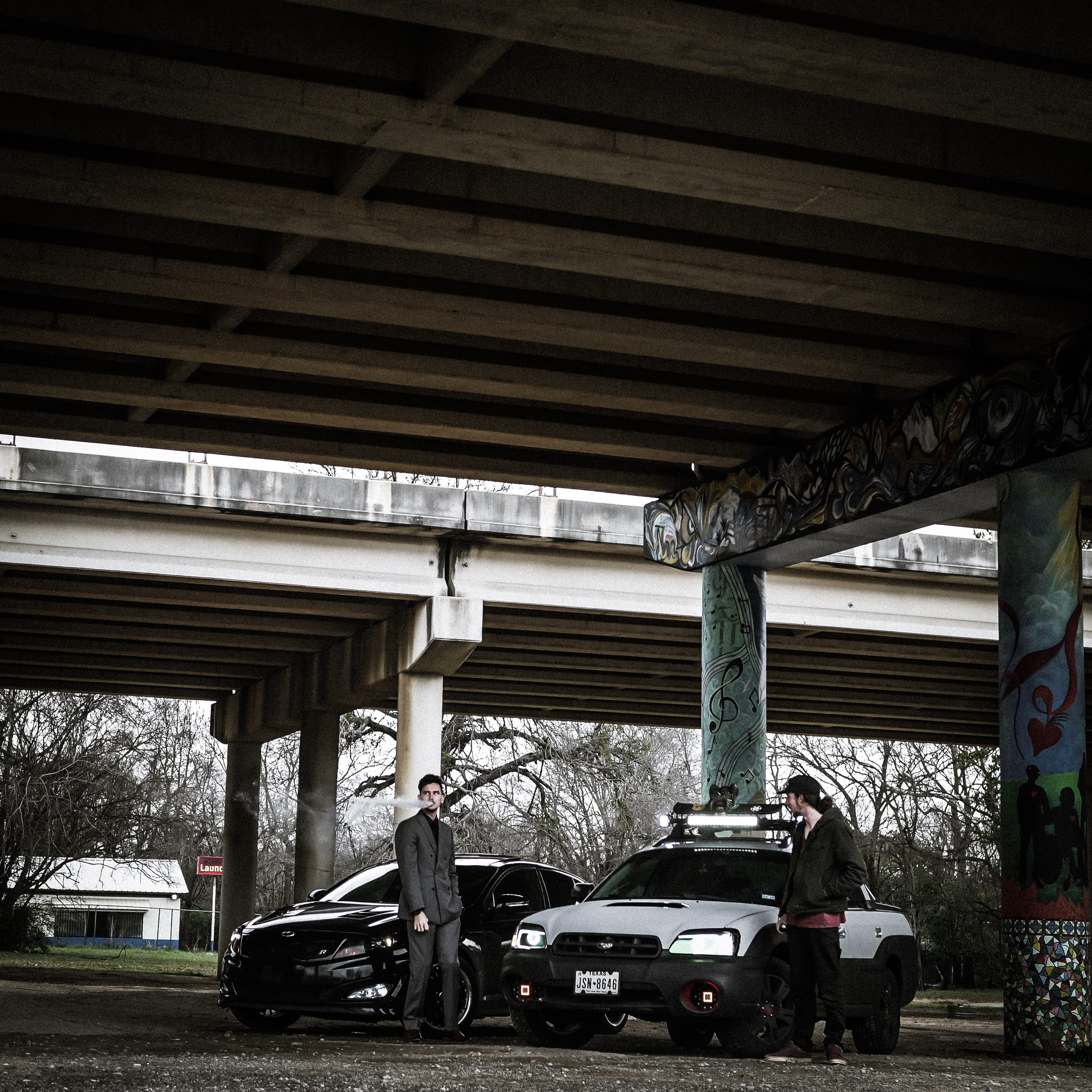 architecture, cars, two, no people, garage, standing, men, 2K, conjunction, man, parking, car, built structure, outdoors, below, urban, ceiling, architectural column, Phone HD Wallpaper