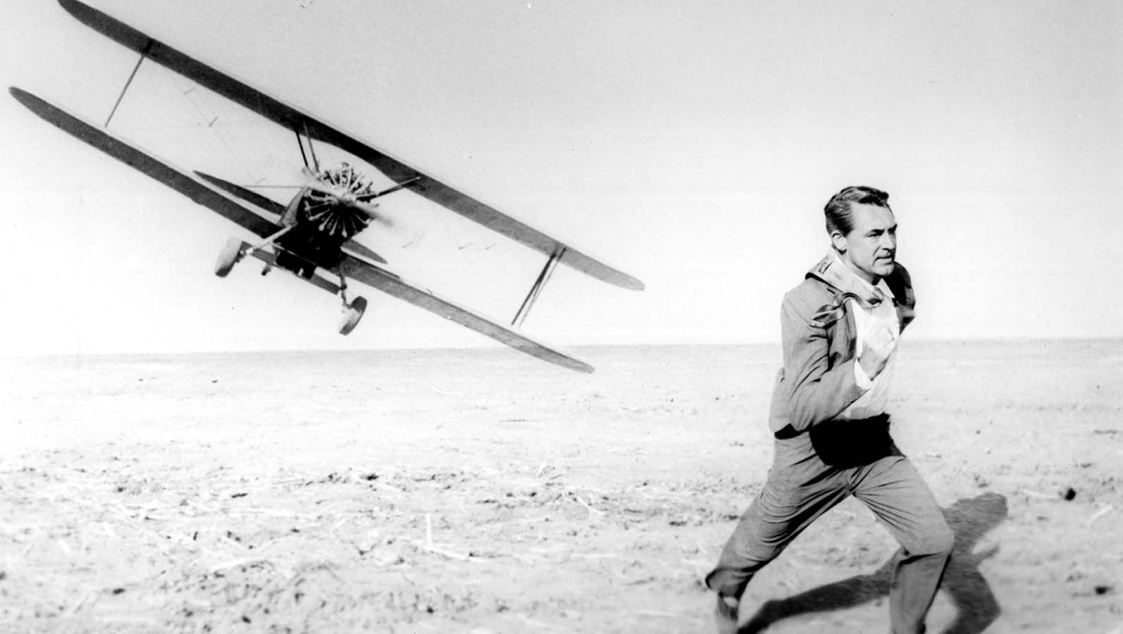 outdoors, young adult, biplane, land, clothing, one person, Cary Grant, sky, Alfred Hitchcock, nature, adult, mode of transportation, airplane, contemplation, HD Wallpaper