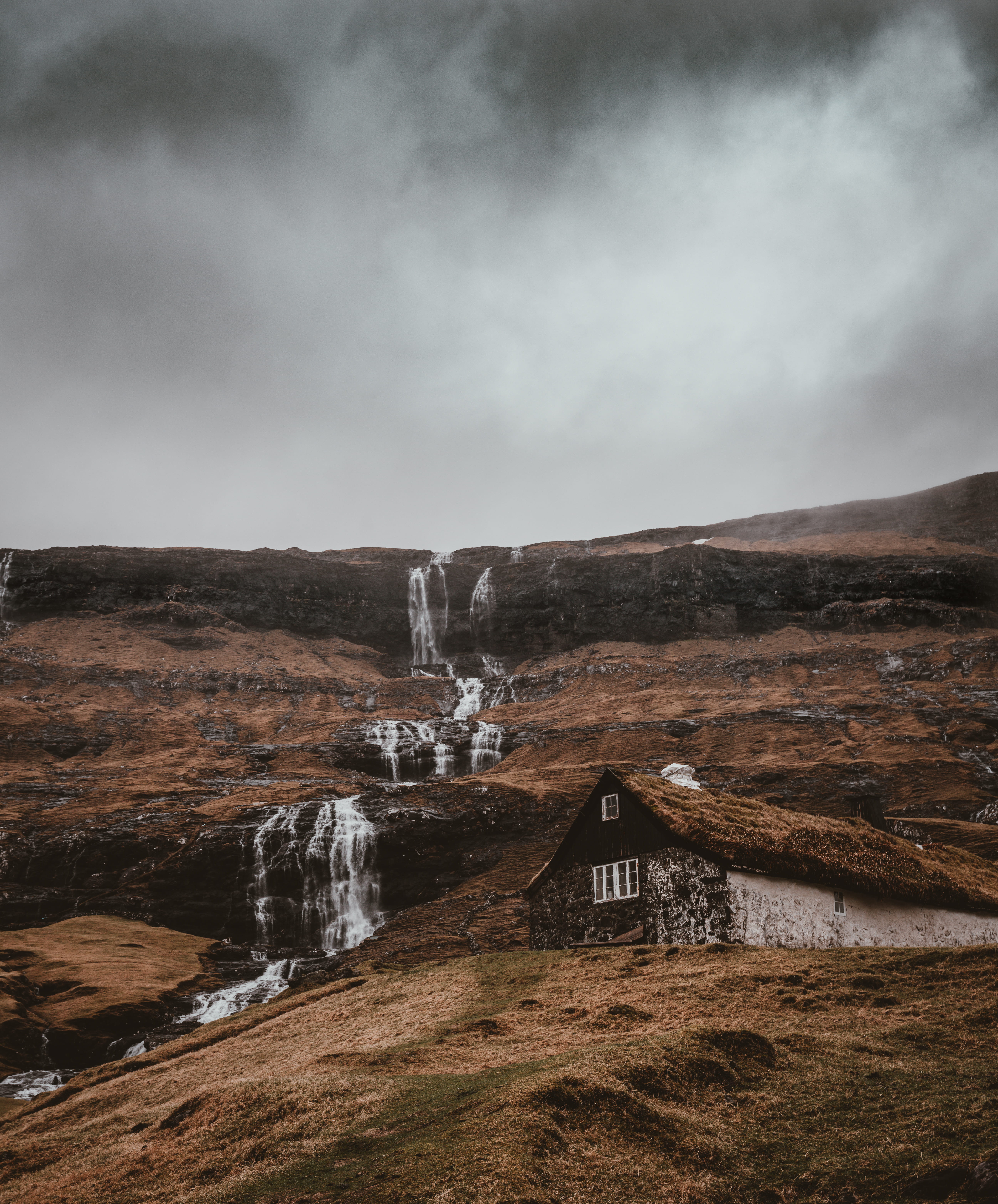 hut, tranquility, turf roof, mountain, 5K, idyllic, near, hill, skies, stone, land, water, environment, flowing water, home, travel destinations, saksun, Phone HD Wallpaper