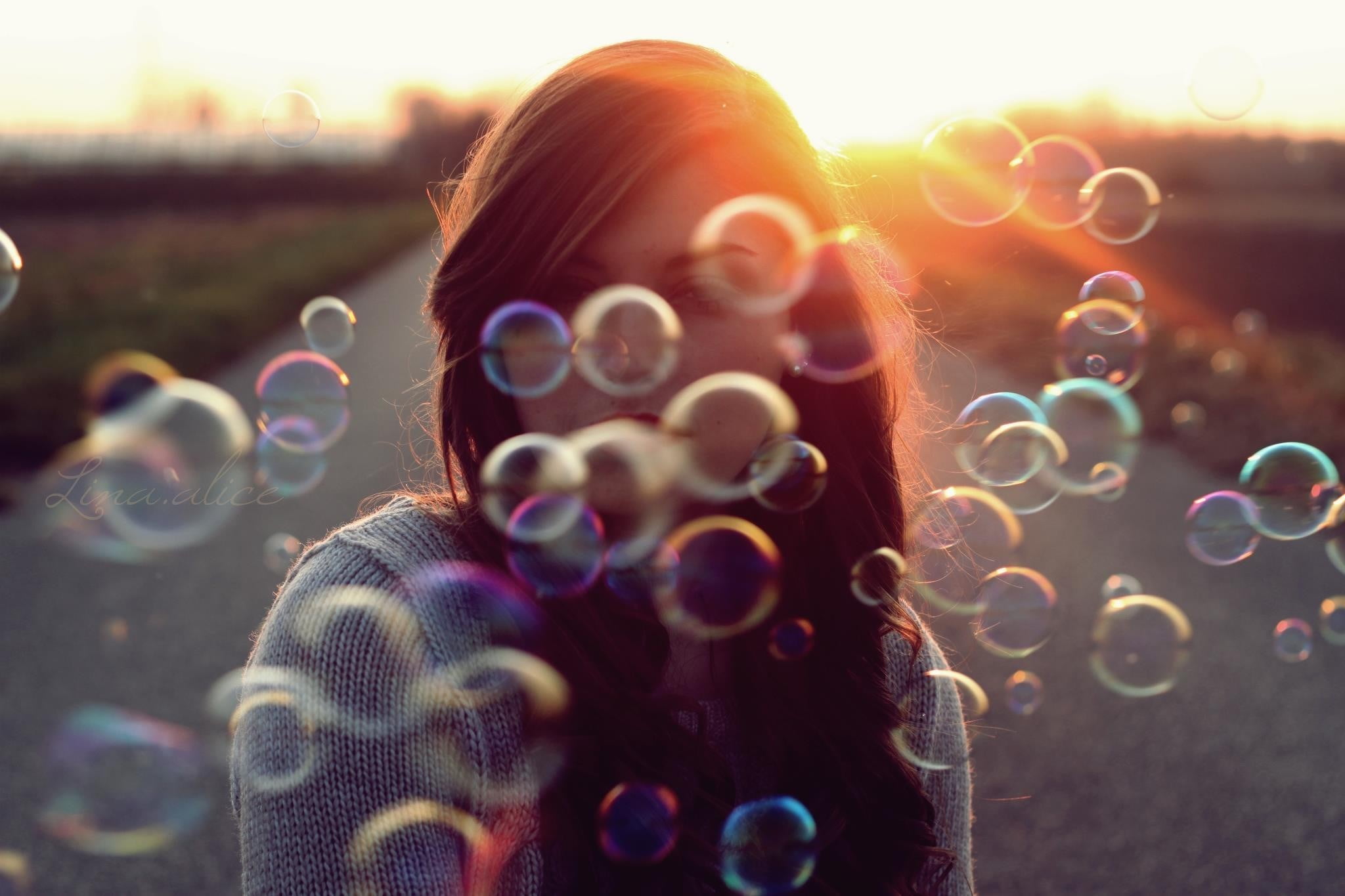 portrait, lens flare, bubbles, front view, nature, blowing, outdoors, bubble wand, model, young adult, bubble, real people, hairstyle, soap sud, vulnerability, HD Wallpaper
