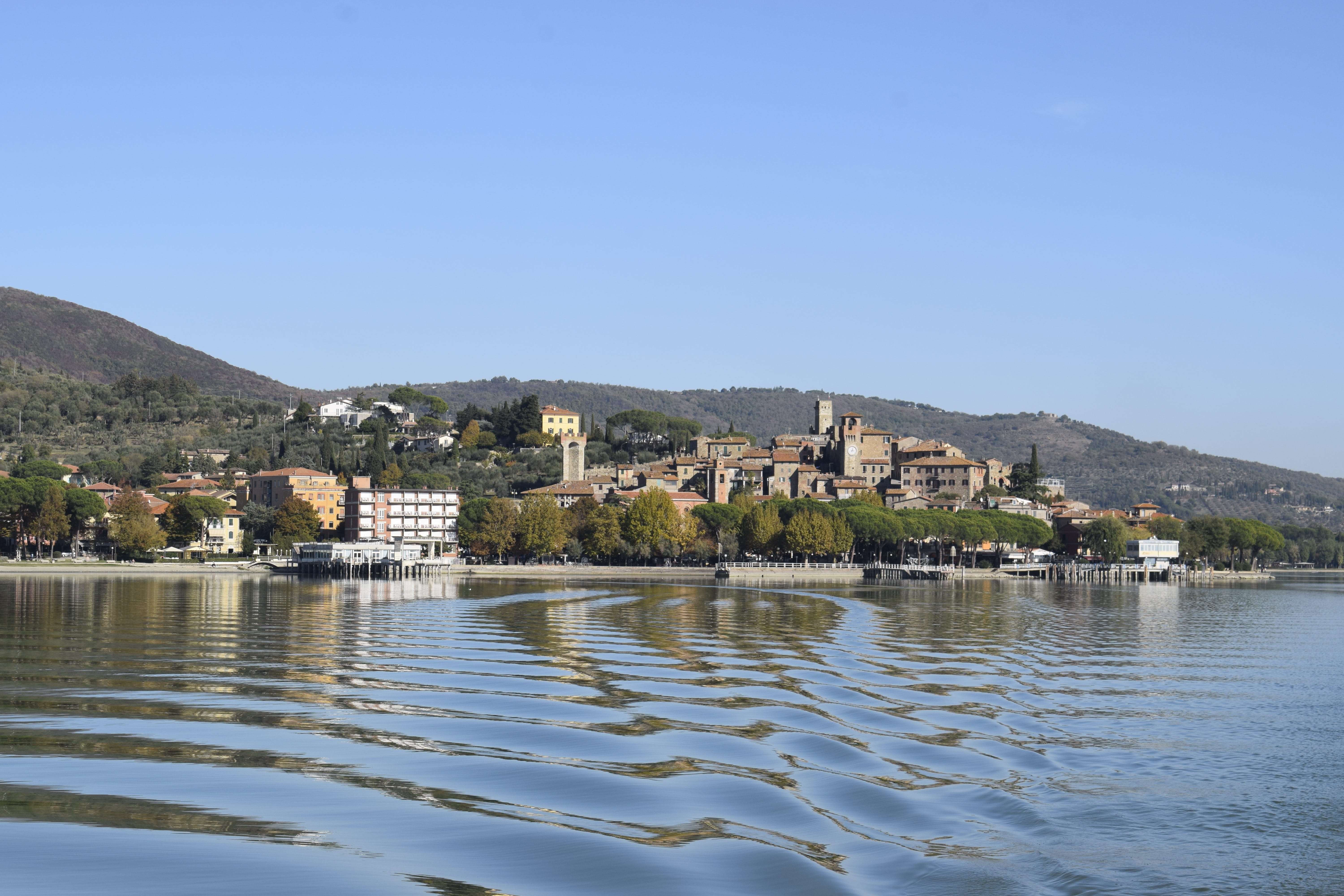 island, tourism, clear sky, travel destinations, waterfront, umbria, water, ferry, trasimeno, passignano, 5K, building exterior, no people, tree, built structure, HD Wallpaper