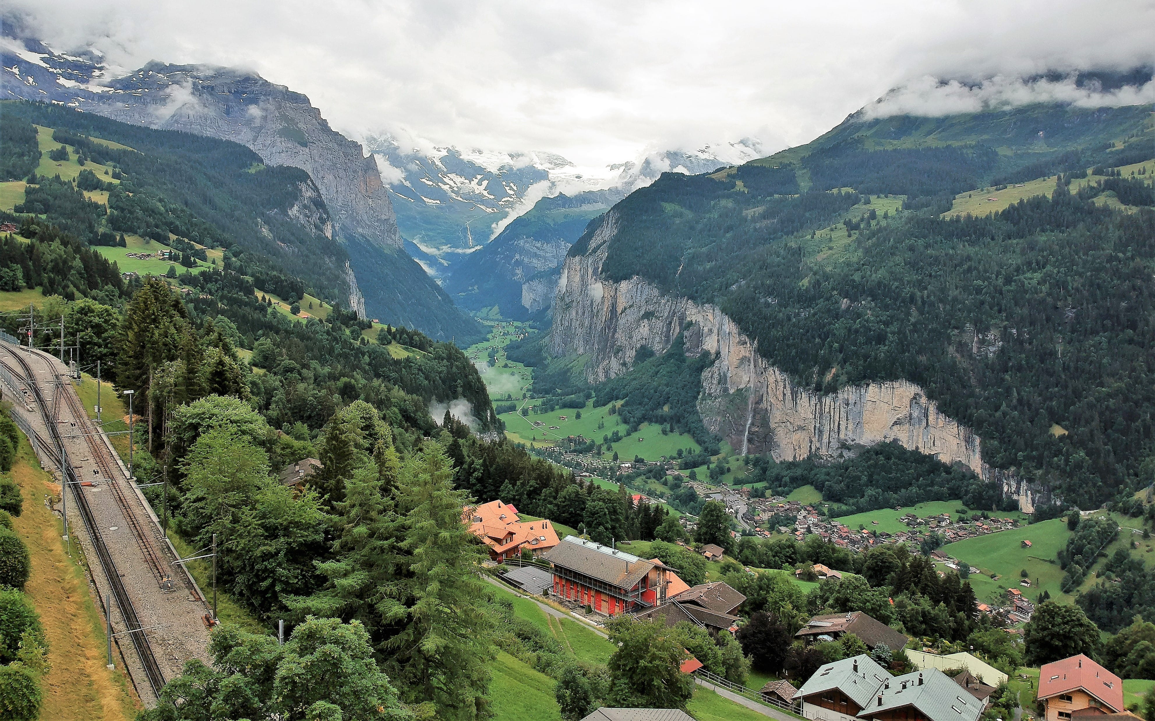 green color, landscape, idyllic, architecture, building exterior, town, daylight, tranquility, road, day, scenery, outdoors, hill, lauterbrunnen, mountain range, HD Wallpaper