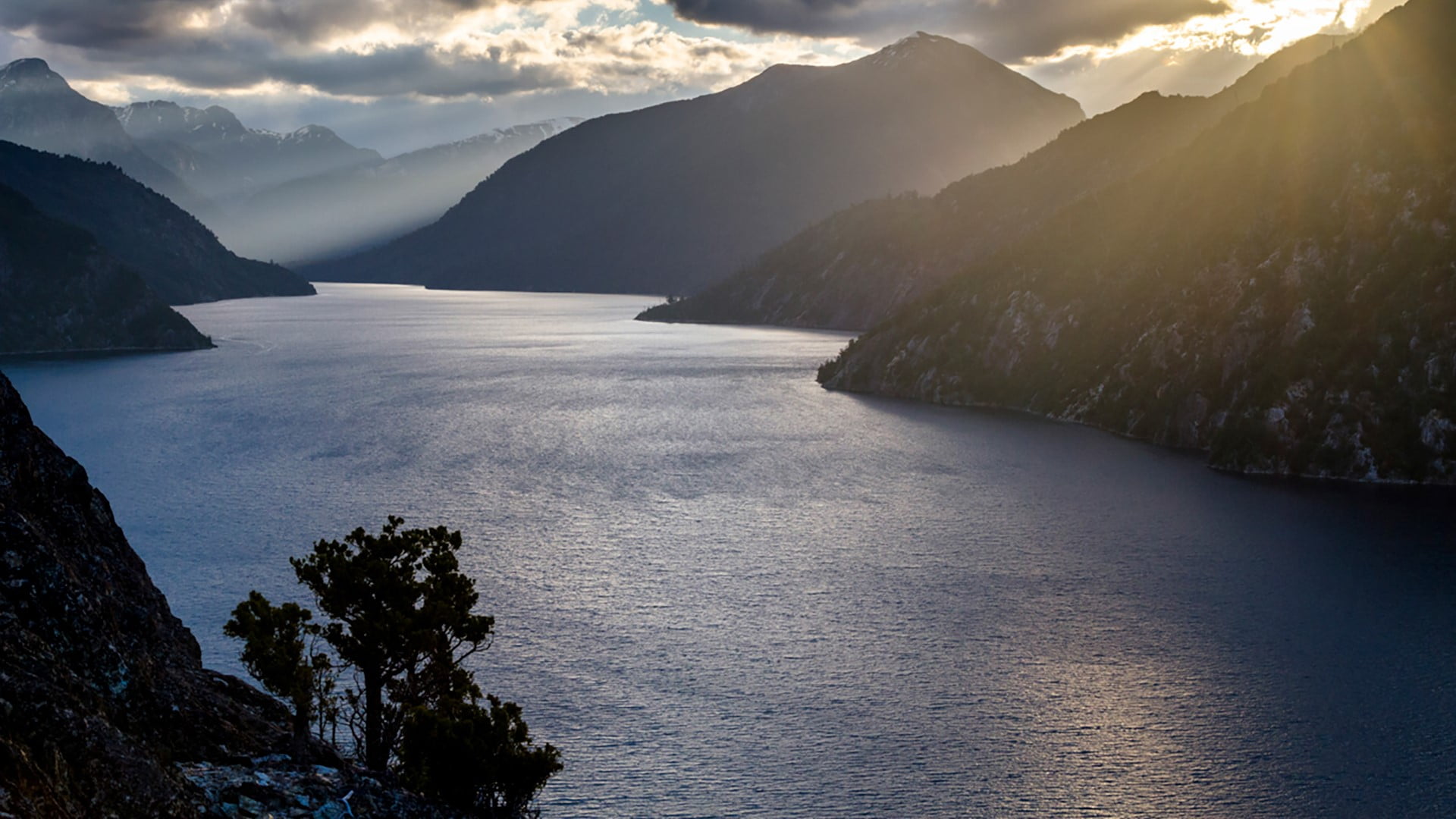 sky, Patagonia, 1080P, river, lake, landscape, Andes, trees, Nahuel Huapi Lake, mountains, nature, Argentina, water ripples, rocks, water, clouds, sun, HD Wallpaper