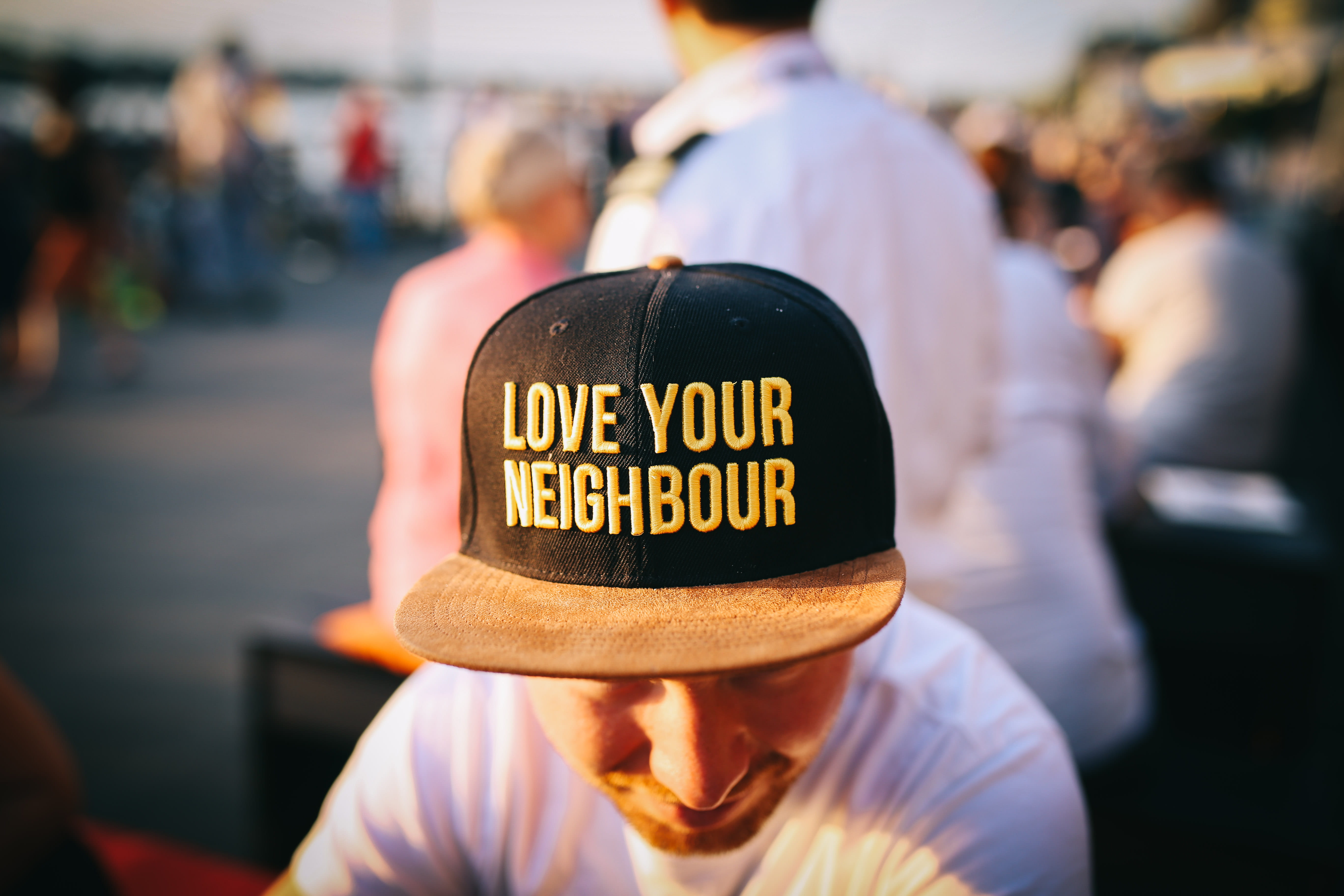 rear view, communication, western script, men, wearing, casual clothing, outdoors, print, love, daytime, clothing, text, cap, real people, incidental people, HD Wallpaper