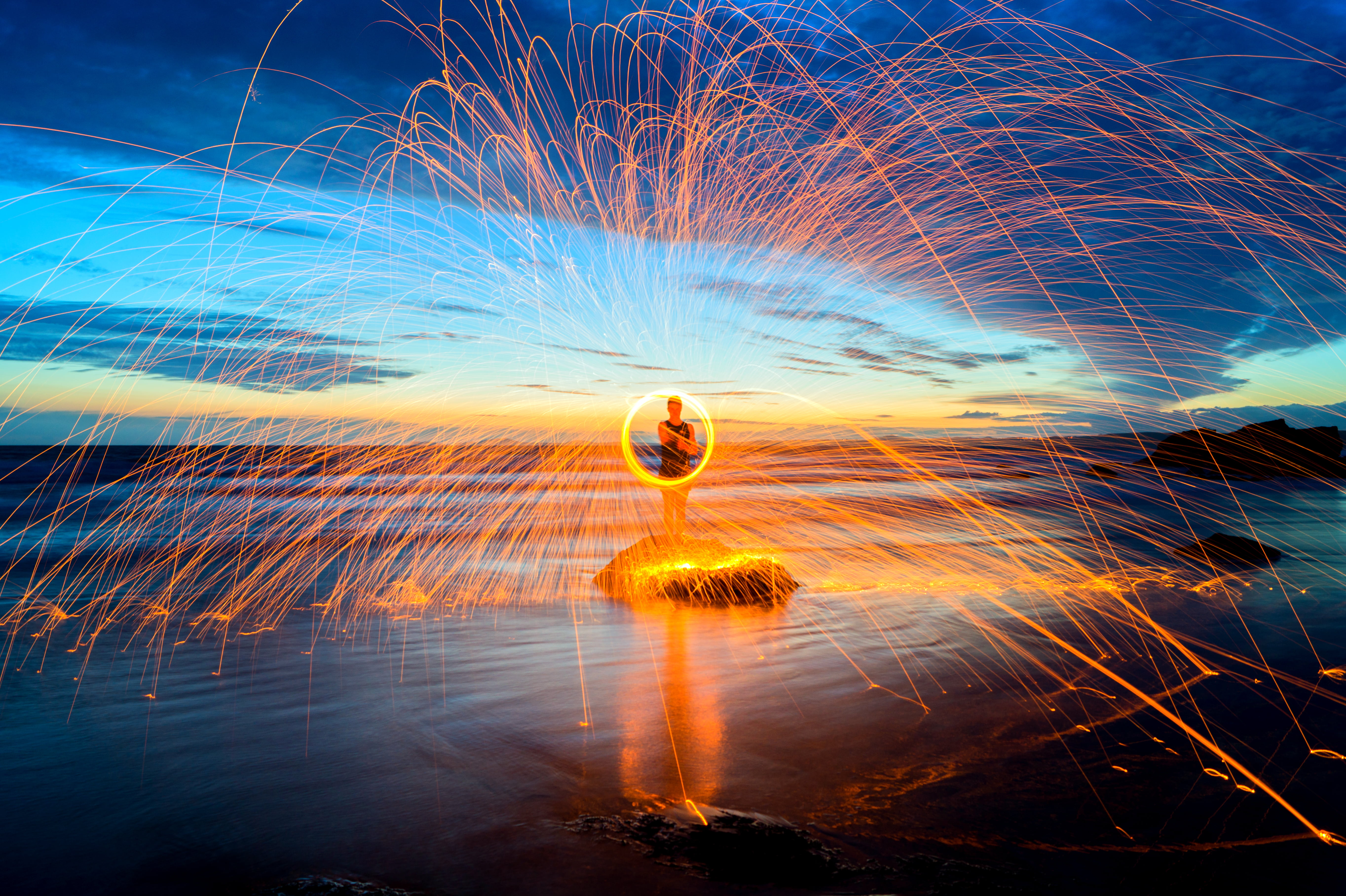 haven  beach, seaside, rocky, 5K, daytime, dark  night, trail, glowing, man, trails, photography, long  exposure, wales, blue, dusk, rocks, cloud, wheel, HD Wallpaper