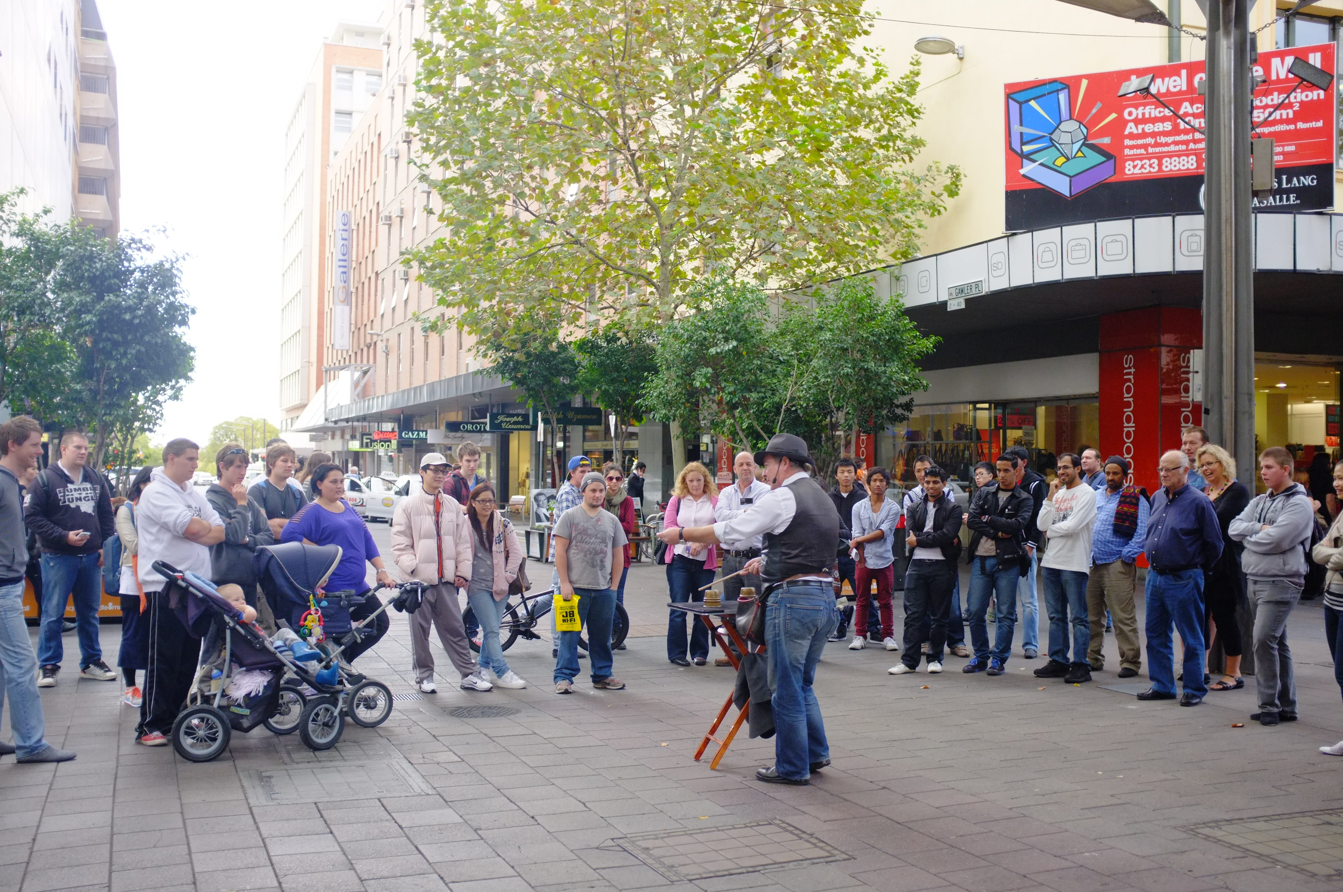 city street, land vehicle, women, mall, day, south australia, city life, men, group of people, plant, illusionist, real people, large group of people, magician, HD Wallpaper