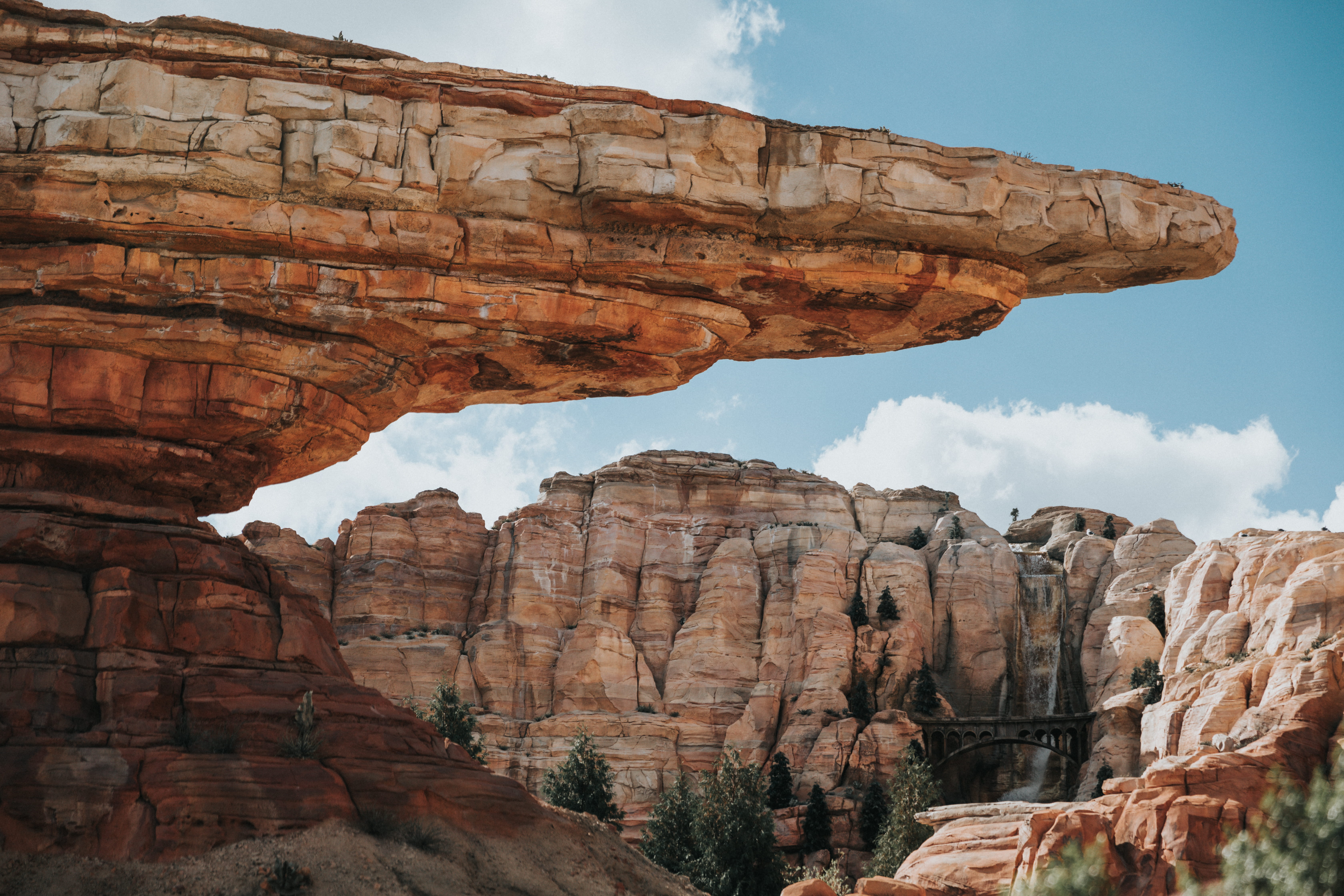 majestic, 5K, sky, movie scene, mountain, famous Place, wilderness, disney, park - Man Made Space, outdoors, stone - Object, red, cars land, national Park, HD Wallpaper