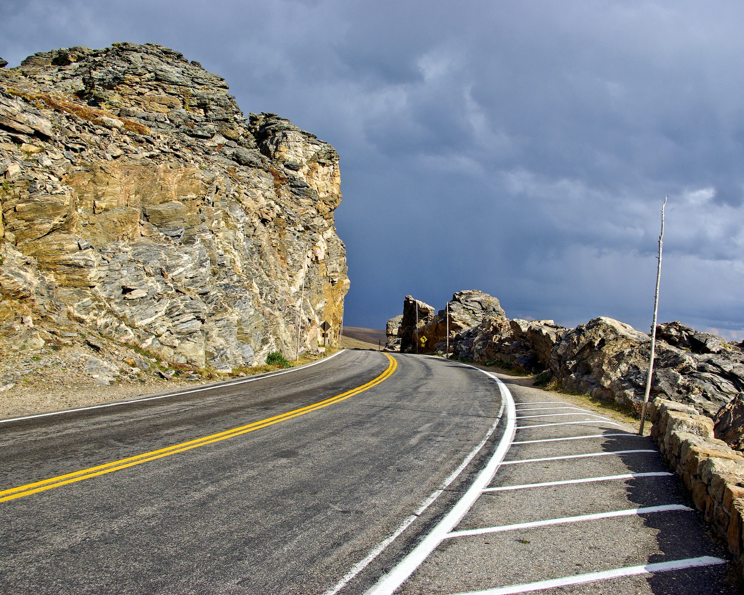 rock, sky, storm, mountain, 2K, mountains, cloud - sky, travel, dividing line, sign, landscape, solid, rocky, day, road marking, direction, road, rock - object, HD Wallpaper