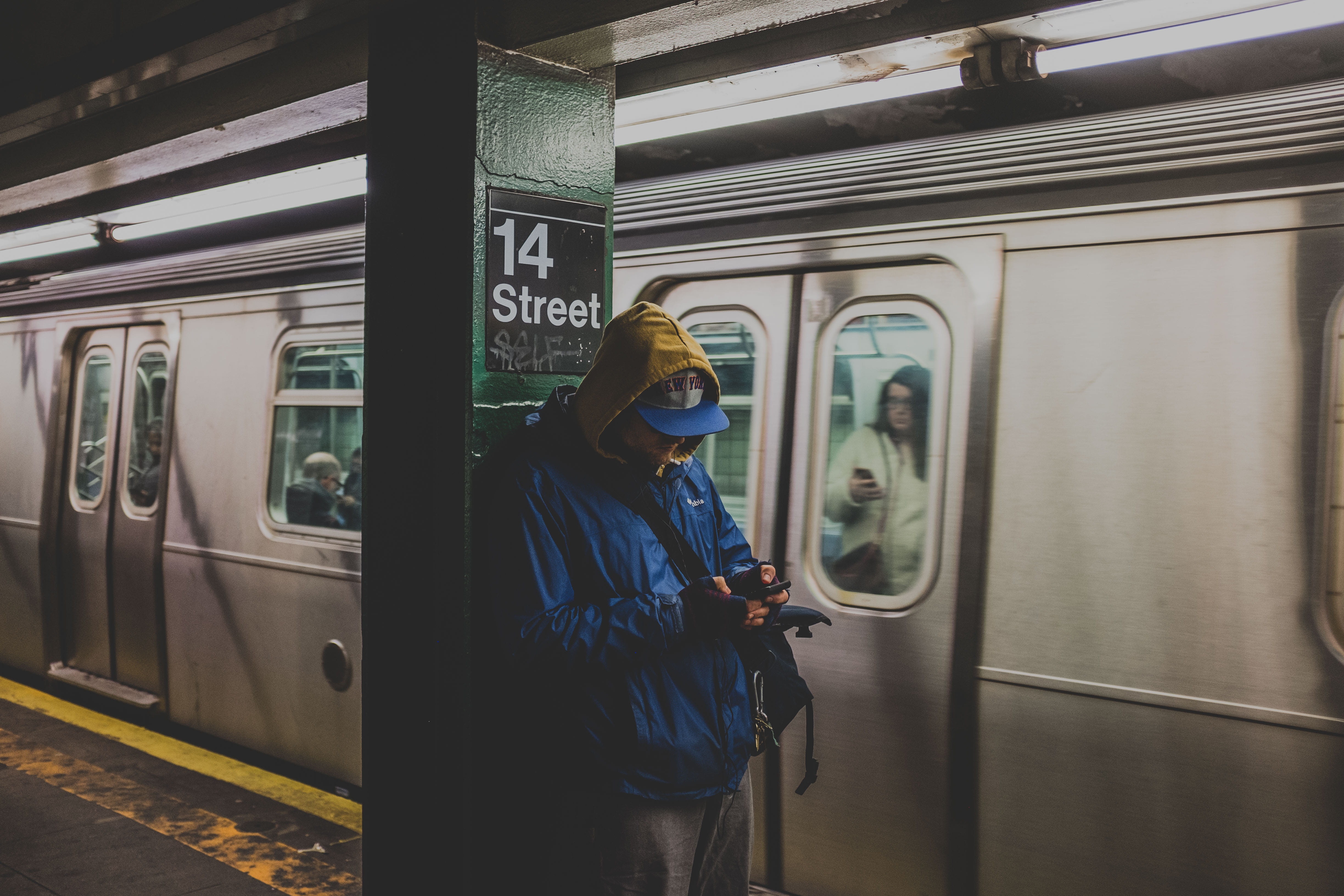 travel, hood, hoodie, underground, metro, lifestyles, motion, communication, mode of transportation, standing, one person, smartphone, looking at phone, HD Wallpaper