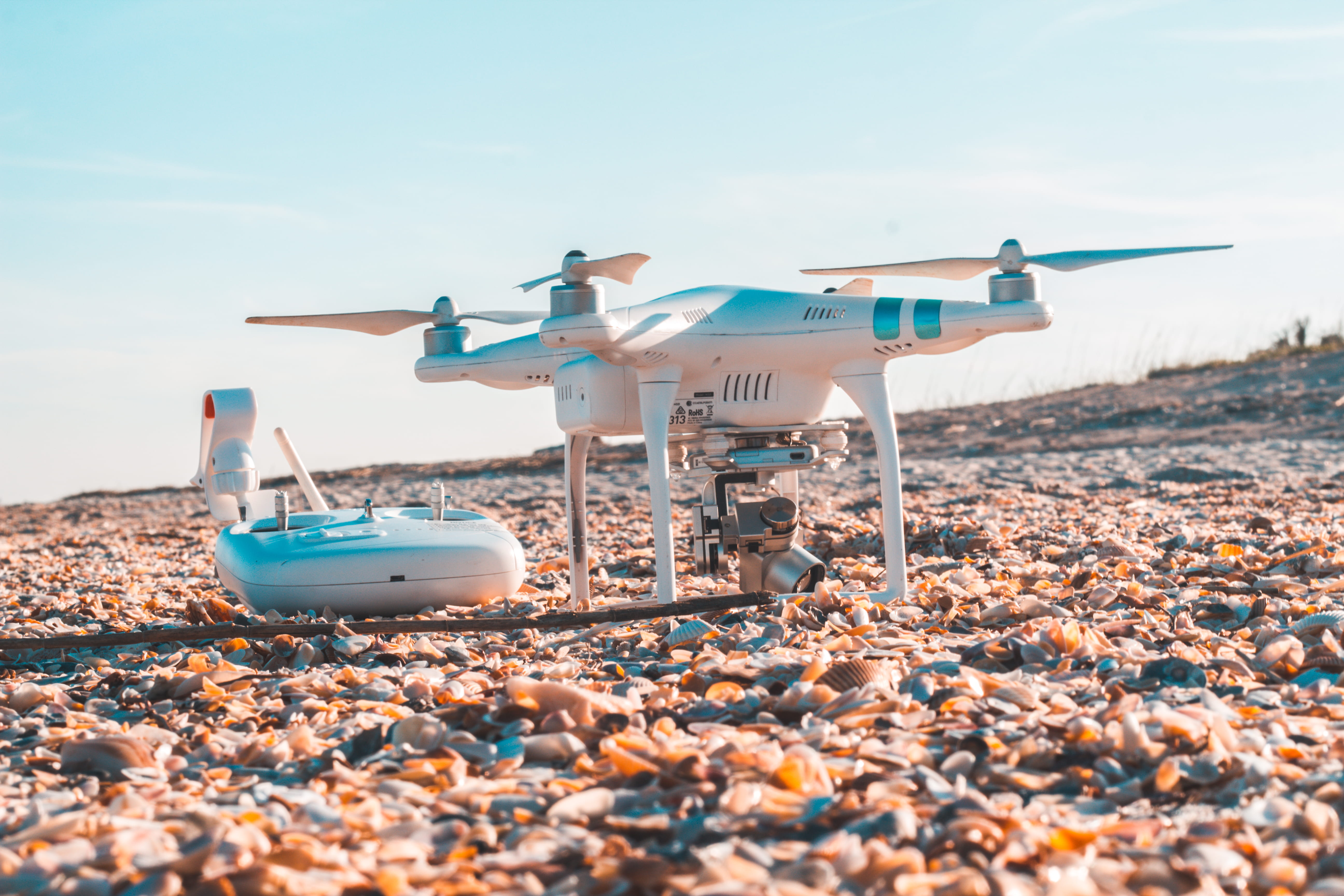 white, pebble, controls, sky, radio, nautical vessel, aircraft, copter, mode of transportation, no people, sea, drone, dji, land, rocky, 5K, travel, nature, HD Wallpaper