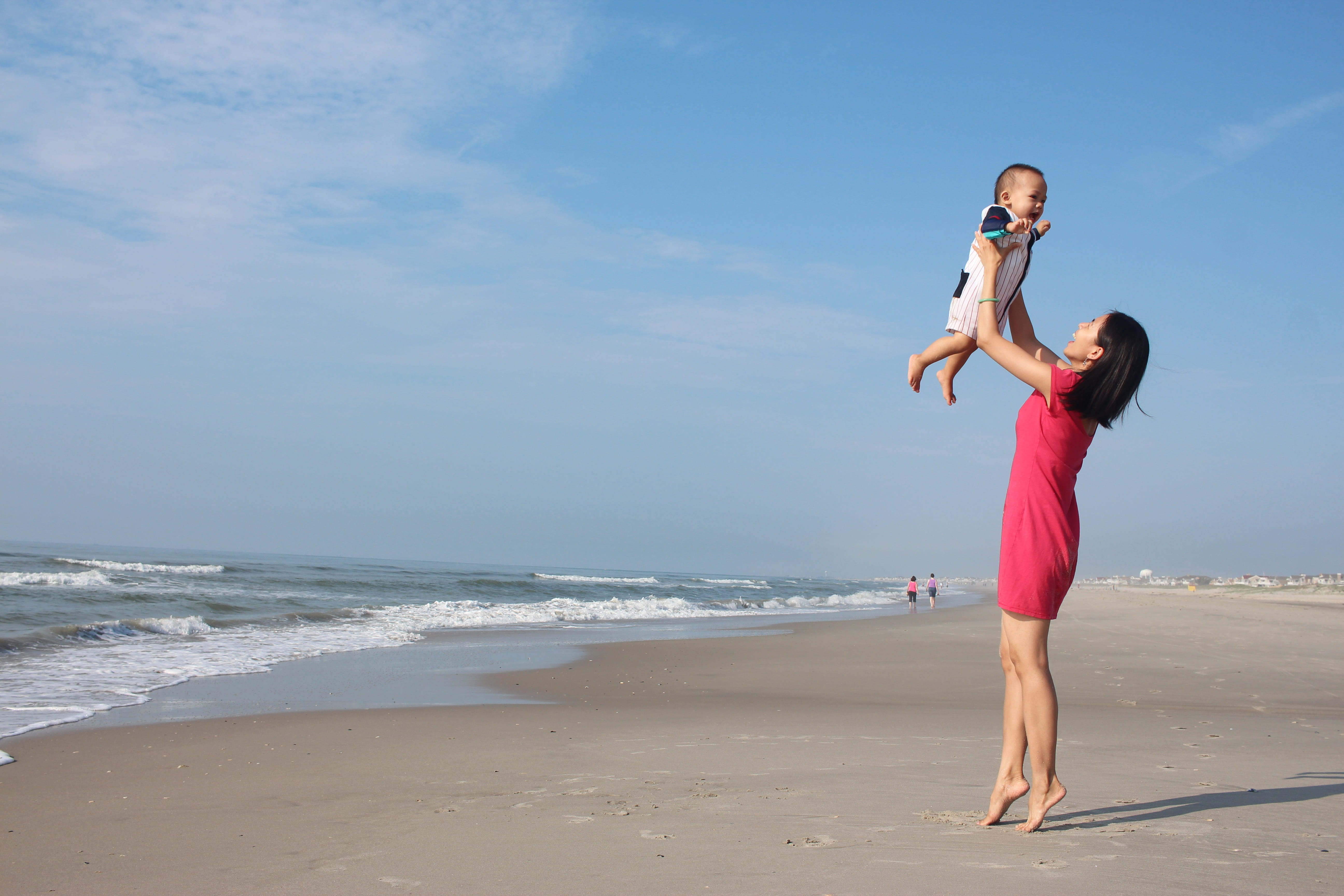 near, fun, boy, ocean, seashore, raising, horizon over water, adult, beauty in nature, outdoors, beach, parent, 5K, motion, sea, love, motherhood, women, HD Wallpaper