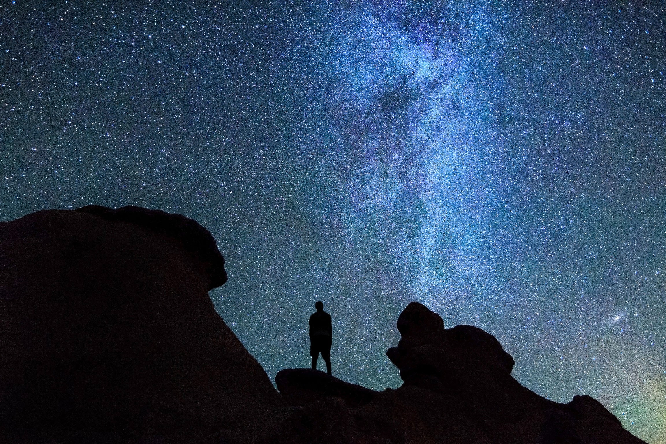 beauty in nature, men, solid, starry, man, space and astronomy, rock, nature, rock formation, sky, scenics - nature, galaxy, silhouette, outdoors, real people, HD Wallpaper