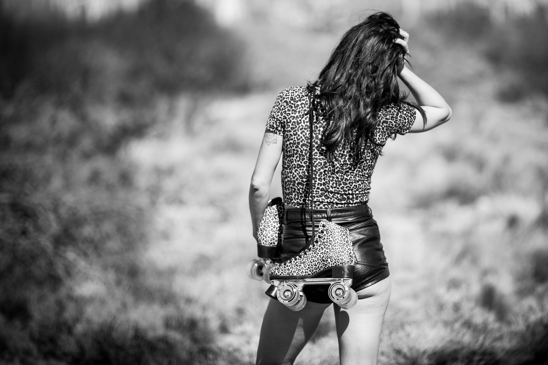 young adult, beautiful woman, shorts, lifestyles, women, day, one person, hairstyle, monochrome, leisure activity, rear view, grass, women outdoors, 1080P, HD Wallpaper