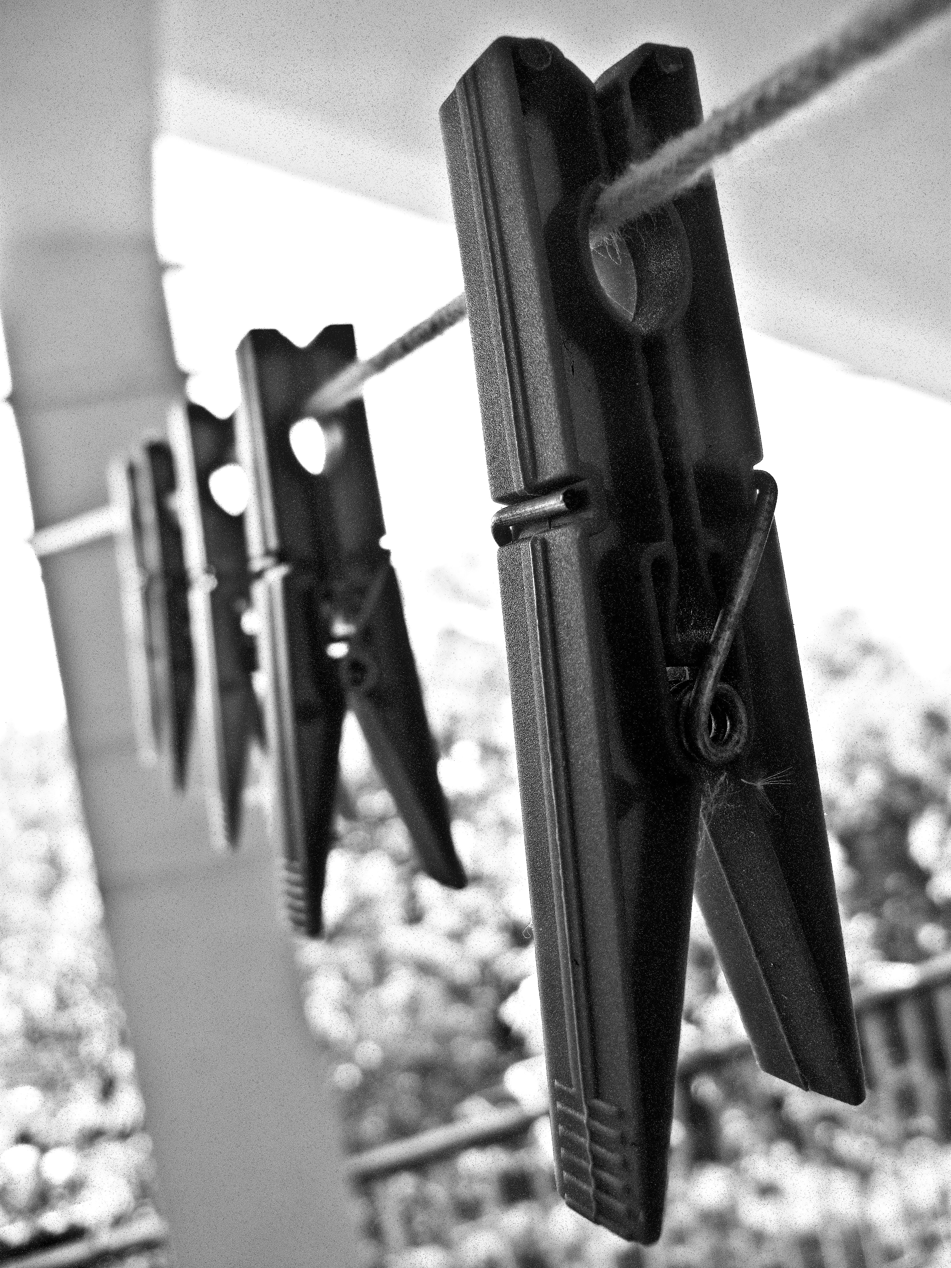 in a row, royalty  images, clothespin, selective focus, clothespins, outdoors, blur, sunlight, built structure, black-and-white, no people, wood - material, Phone HD Wallpaper