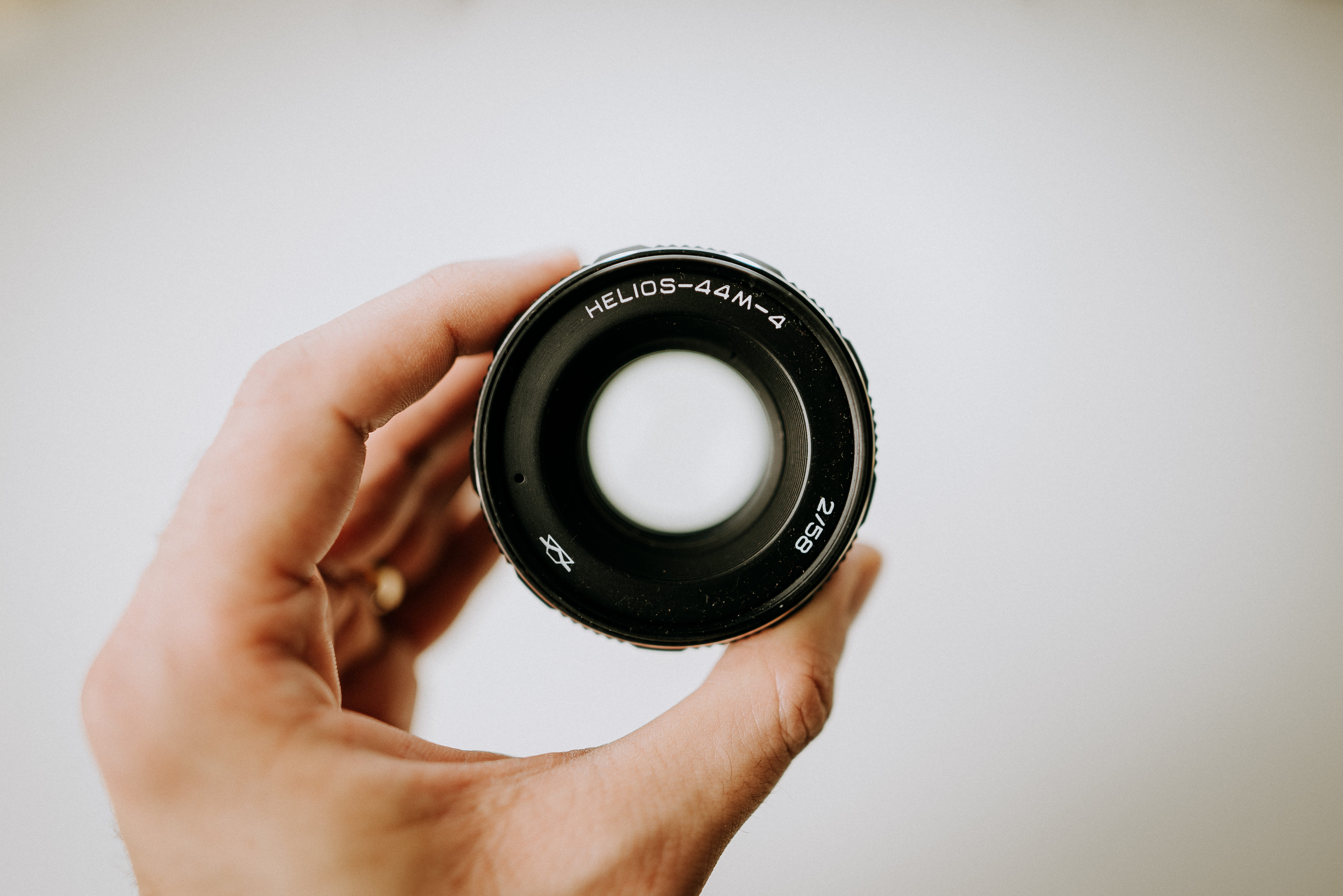 hand, photographer, alloy wheel, swirly bokeh, unrecognizable person, black, camera - photographic equipment, electronics, photography themes, studio shot, HD Wallpaper