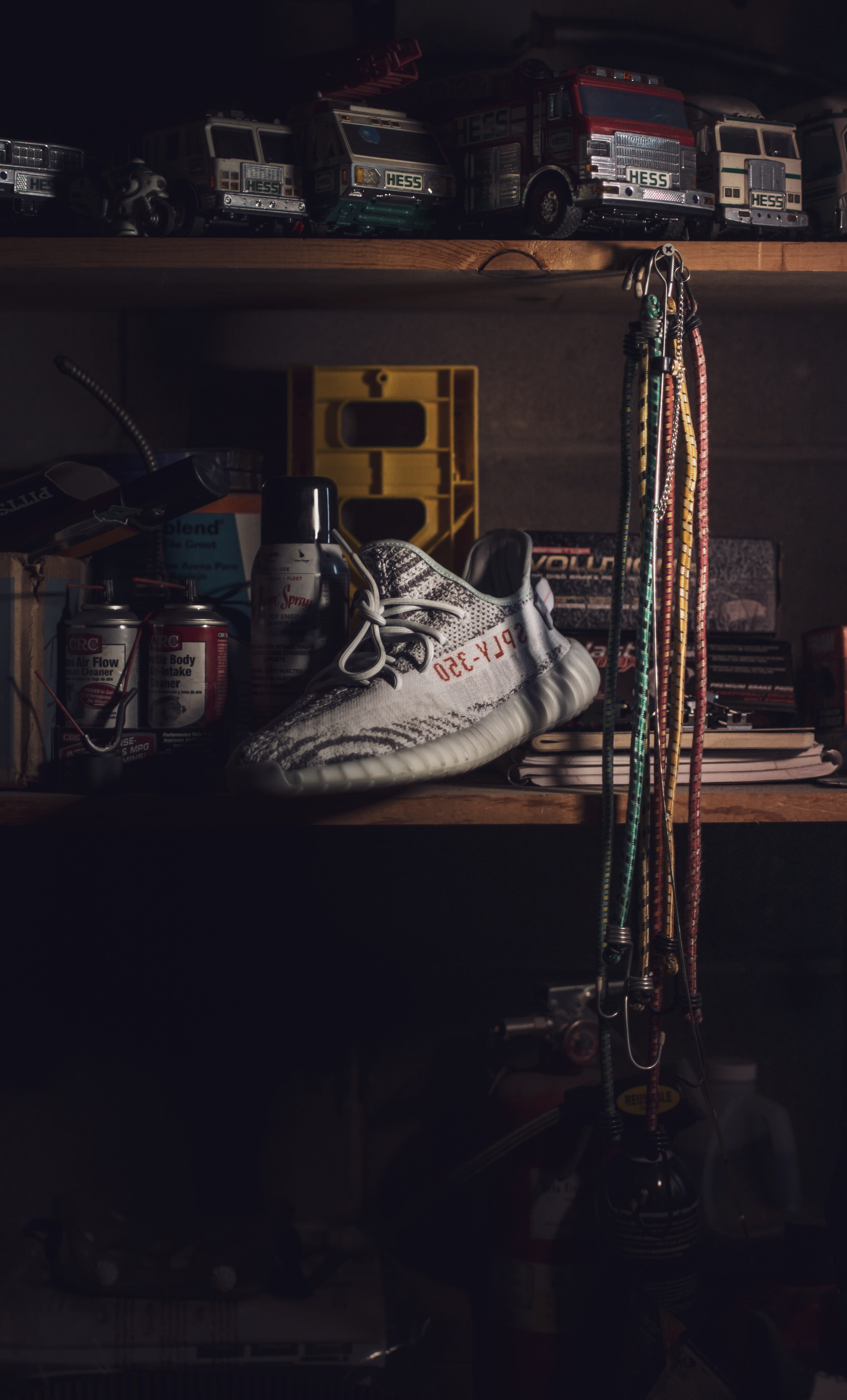 furniture, large group of objects, arrangement, clothing, container, absence, trucks, vehicles, garage, order, yeezy, adidas, equipment, wood, shelf, shoe, Phone HD Wallpaper