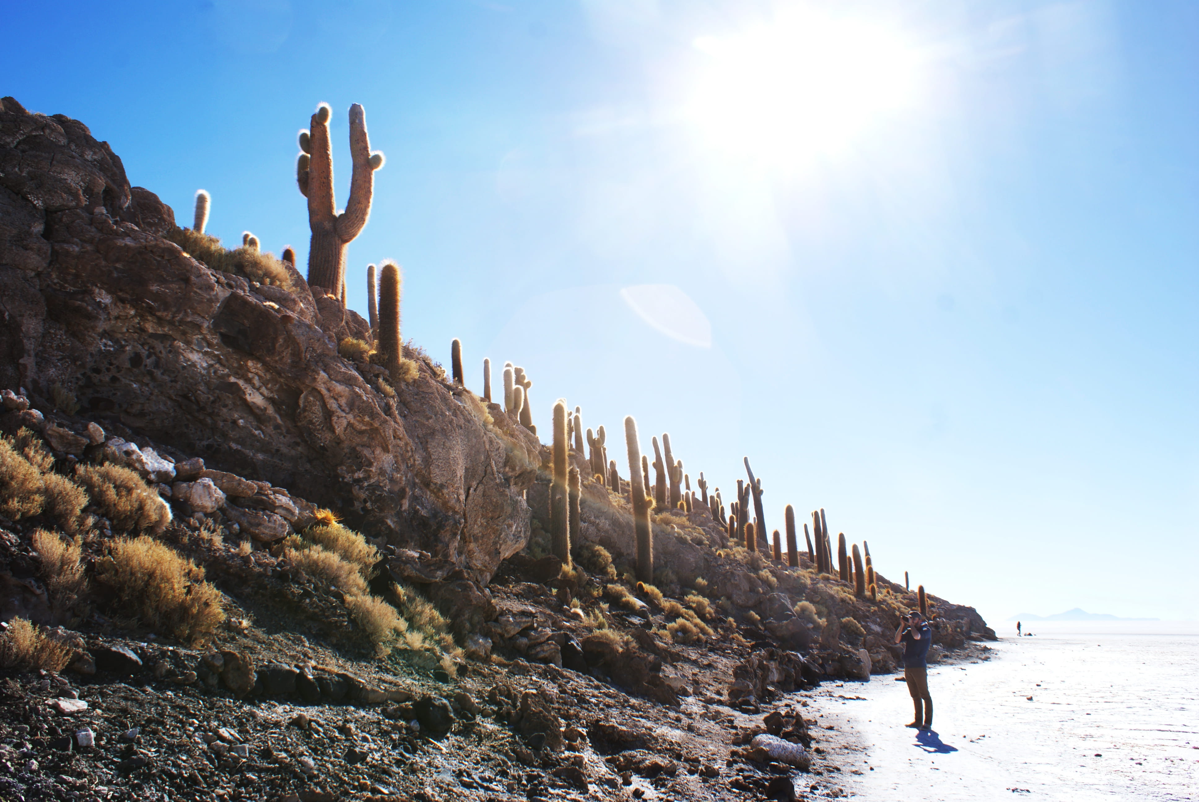 sun, sunset, solid, rock - object, desert, bolivia, day, sunbeam, cactus, lens flare, rock, beauty in nature, outdoors, men, group of people, sea, sky, HD Wallpaper