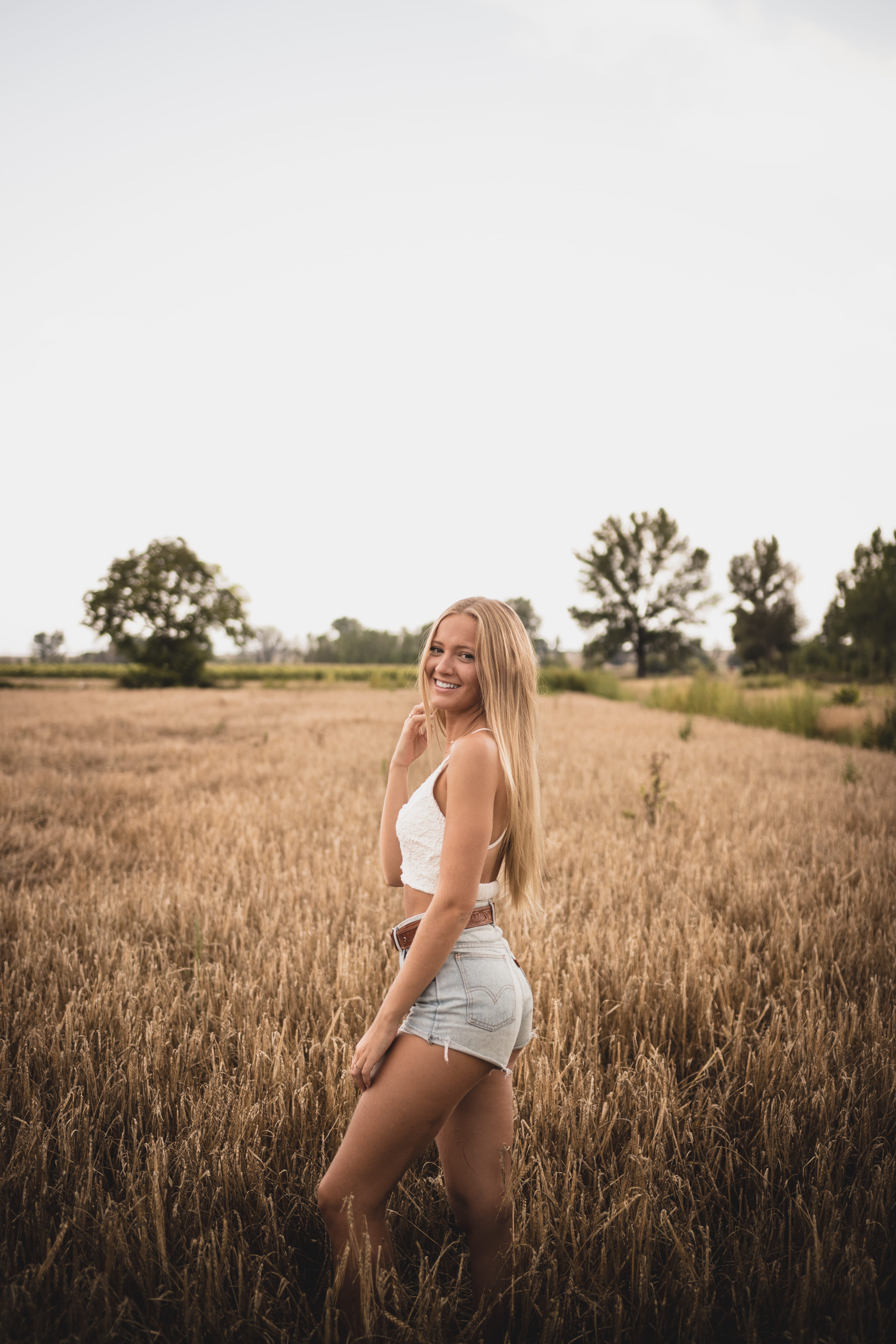 sun, tree, female, rural Scene, standing, smiling, beauty In Nature, short, model, caucasian Ethnicity, young Adult, freedom, enjoyment, sunlight, beautiful, Phone HD Wallpaper