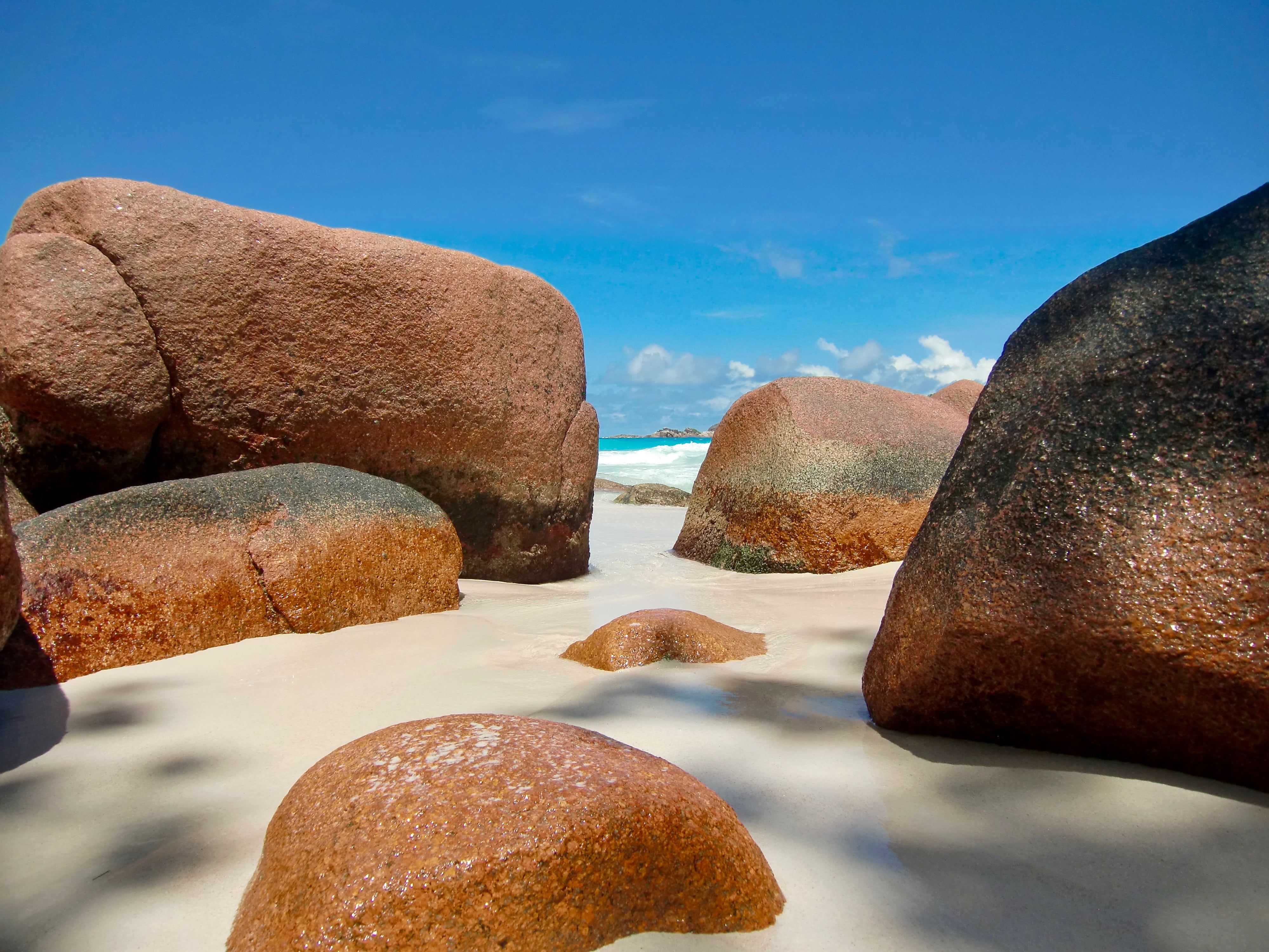 tranquility, 4K, brown, sunlight, rock, sand, solid, nature, rock - object, land, sea, day, rusty, beach, cloud - sky, water, outdoors, close-up, praslin, HD Wallpaper