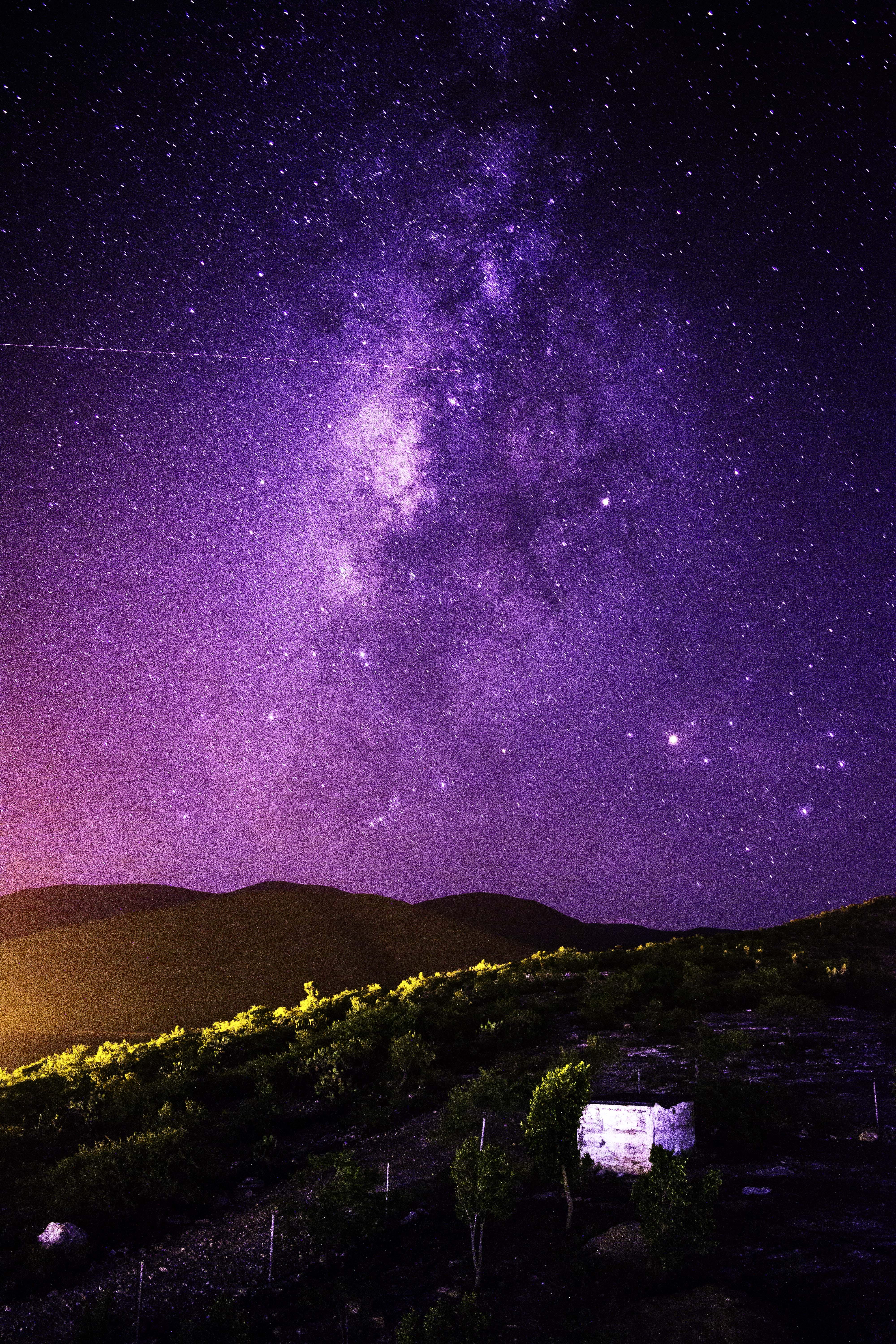 galaxy, high angle shot, light, star - space, sky, bright, beauty in nature, nature, constellation, mountain, dark, star field, architecture, milky way, Phone HD Wallpaper