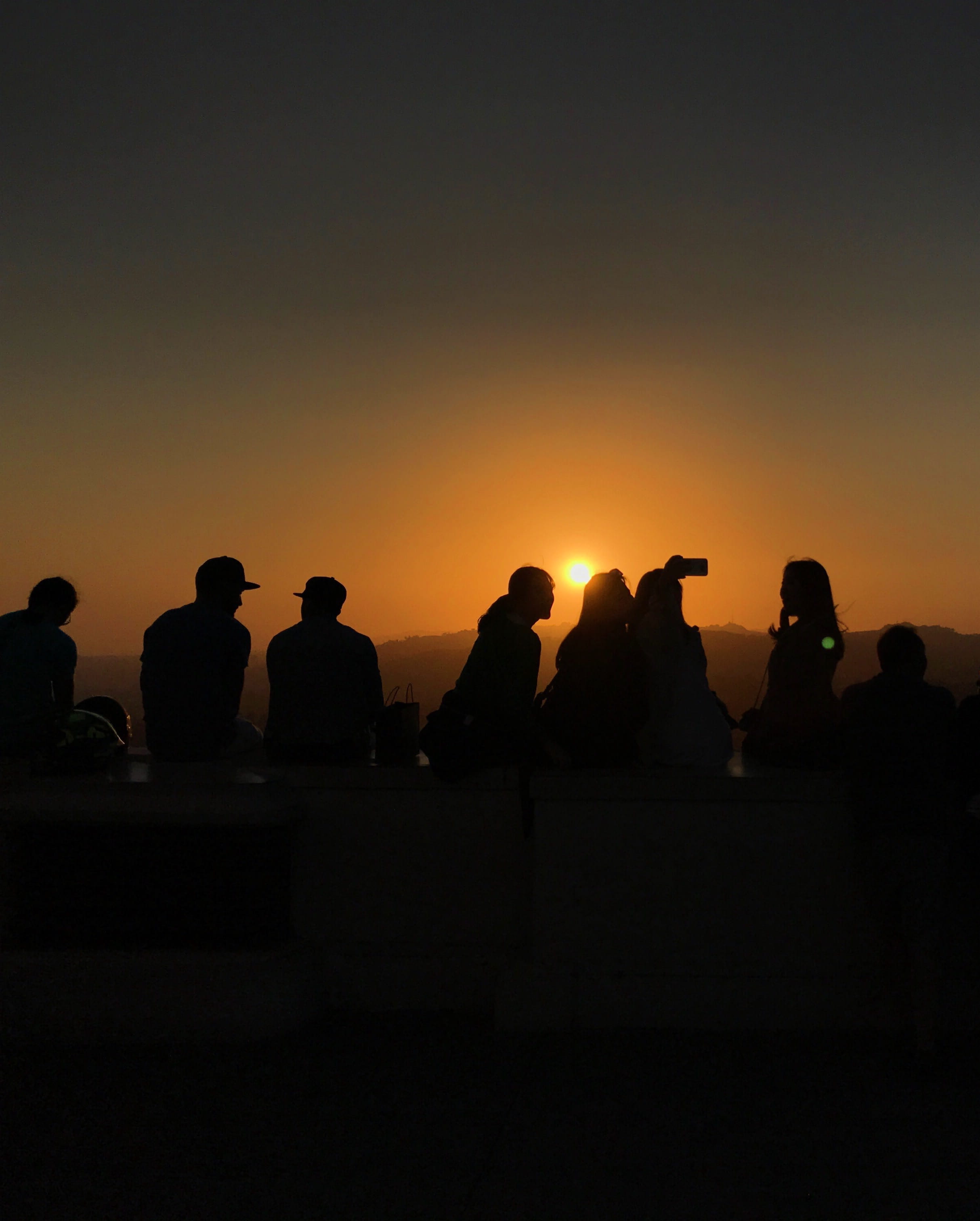 clear sky, sitting, casual, medium group of people, silhouette, real people, men, crowd, leisure activity, sunset, selfie, sky, los angeles, griffith observatory, Phone HD Wallpaper