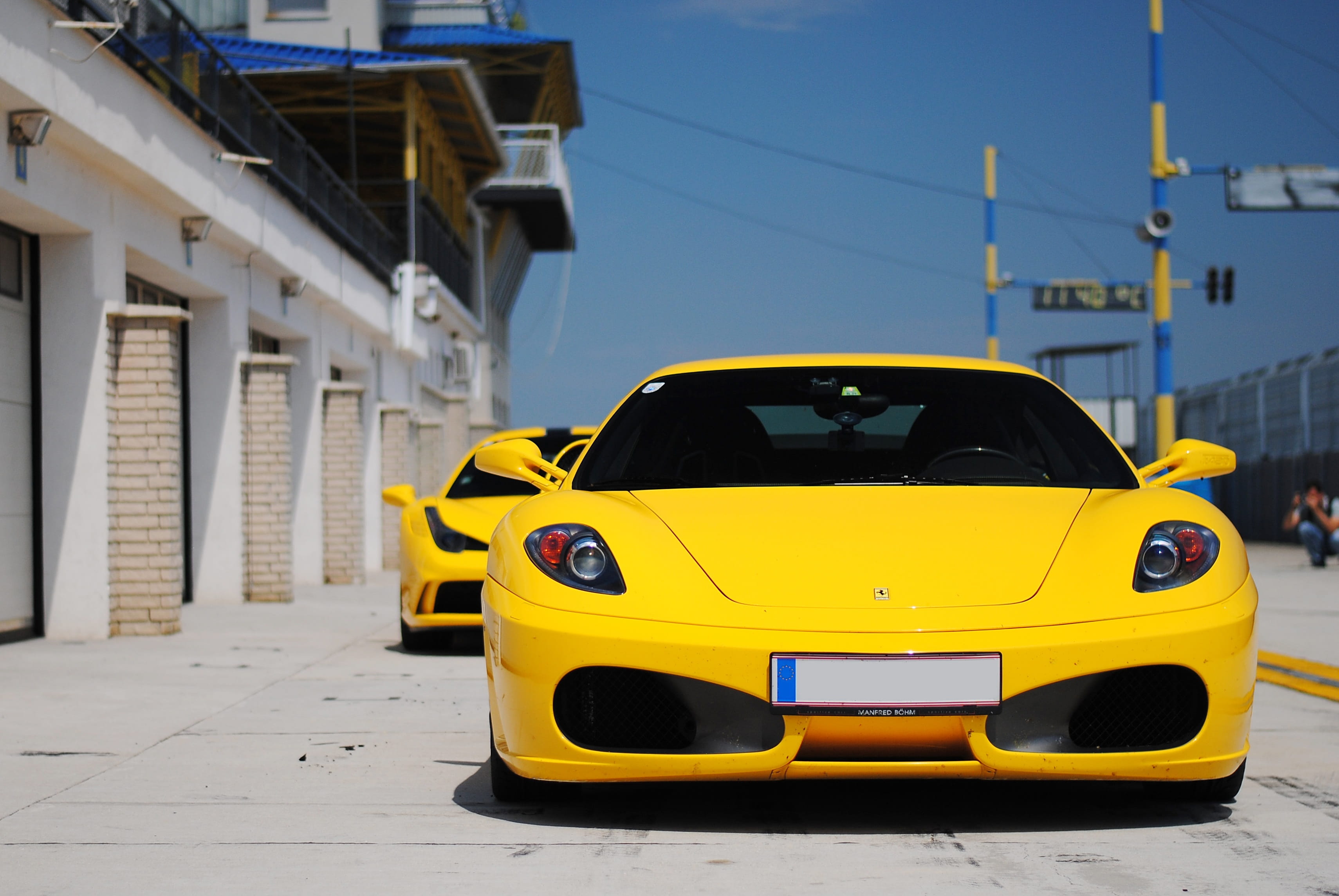 motor vehicle, lifestyle, Ferrari, horsepower, Italia, fuel, street, building exterior, motorshow, sports, motor, muscle, daytime, speed, city, building, HD Wallpaper