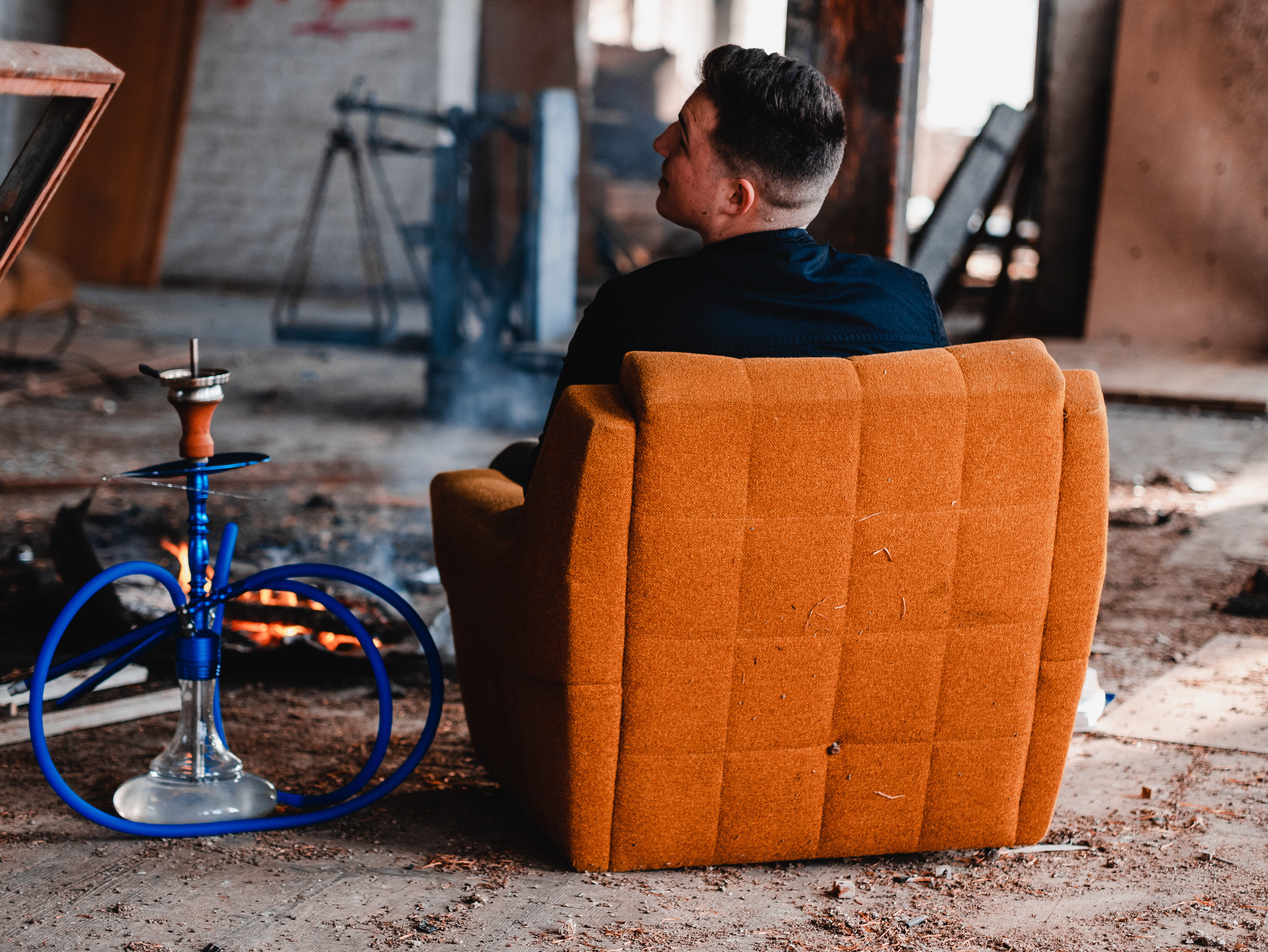 suede, campfire, real people, hookah, box, outdoors, man, men, building, padded, sofa, bike, beside, 4K, person, one person, gray, land vehicle, orange color, HD Wallpaper