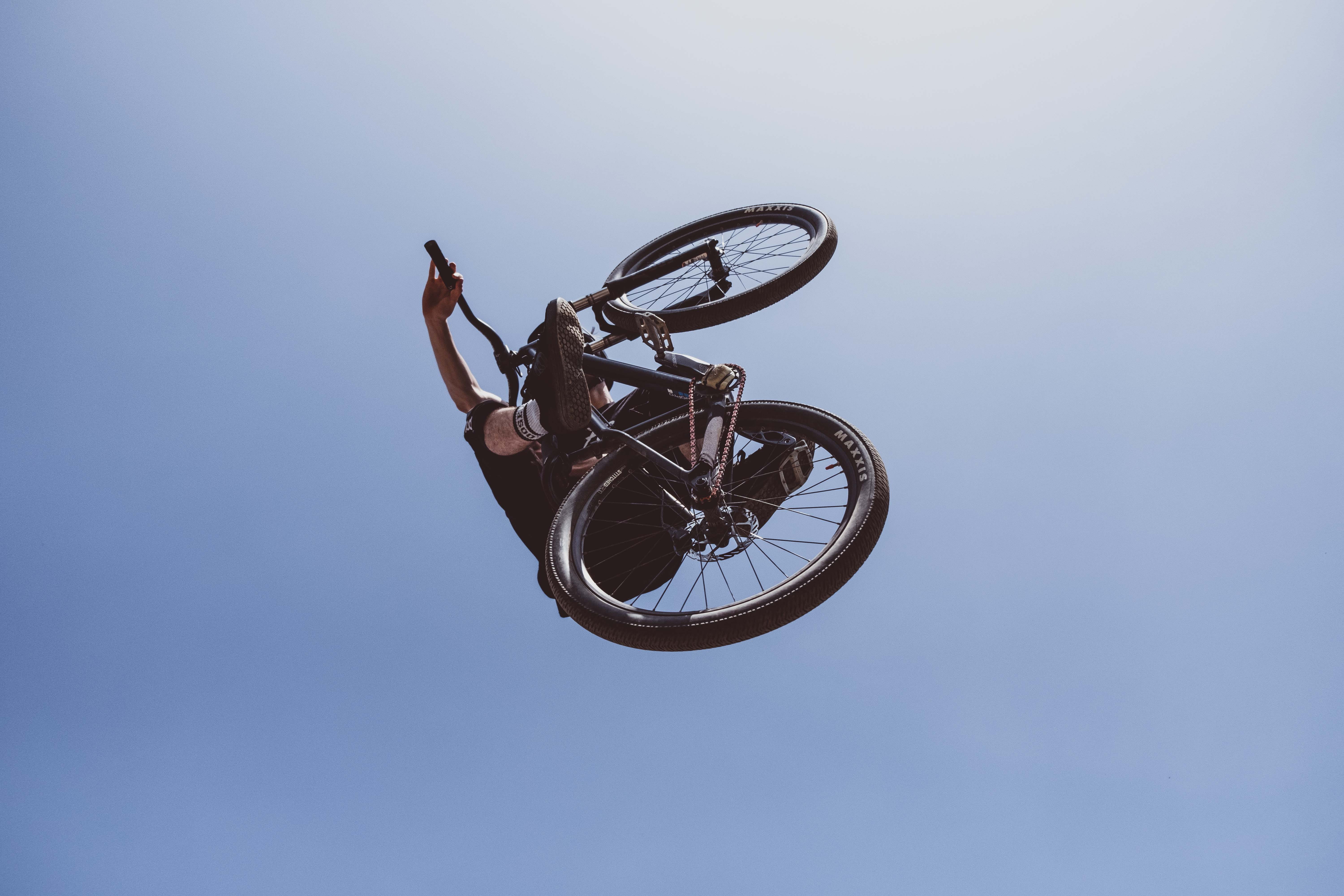 bike, person, brick, activity, wheel, clear sky, vehicle, low angle view, blue, adventure, housing, black, cycling, mountain biking, spoke, leisure activity, HD Wallpaper
