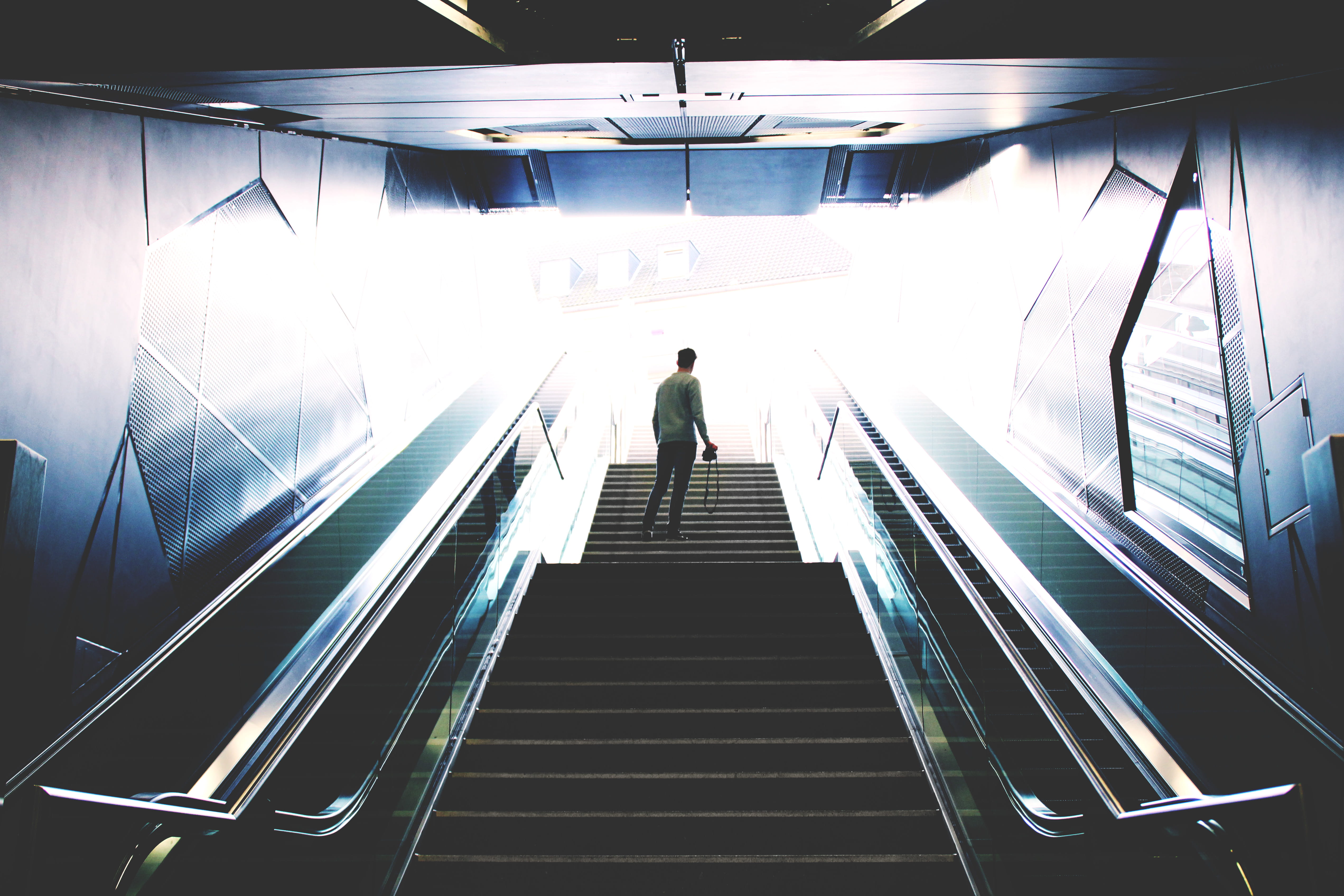 transportation, metal, direction, illuminated, rear view, people Traveling, one person, person, standing, lifestyles, subway, motion, moving walkway, modern, HD Wallpaper