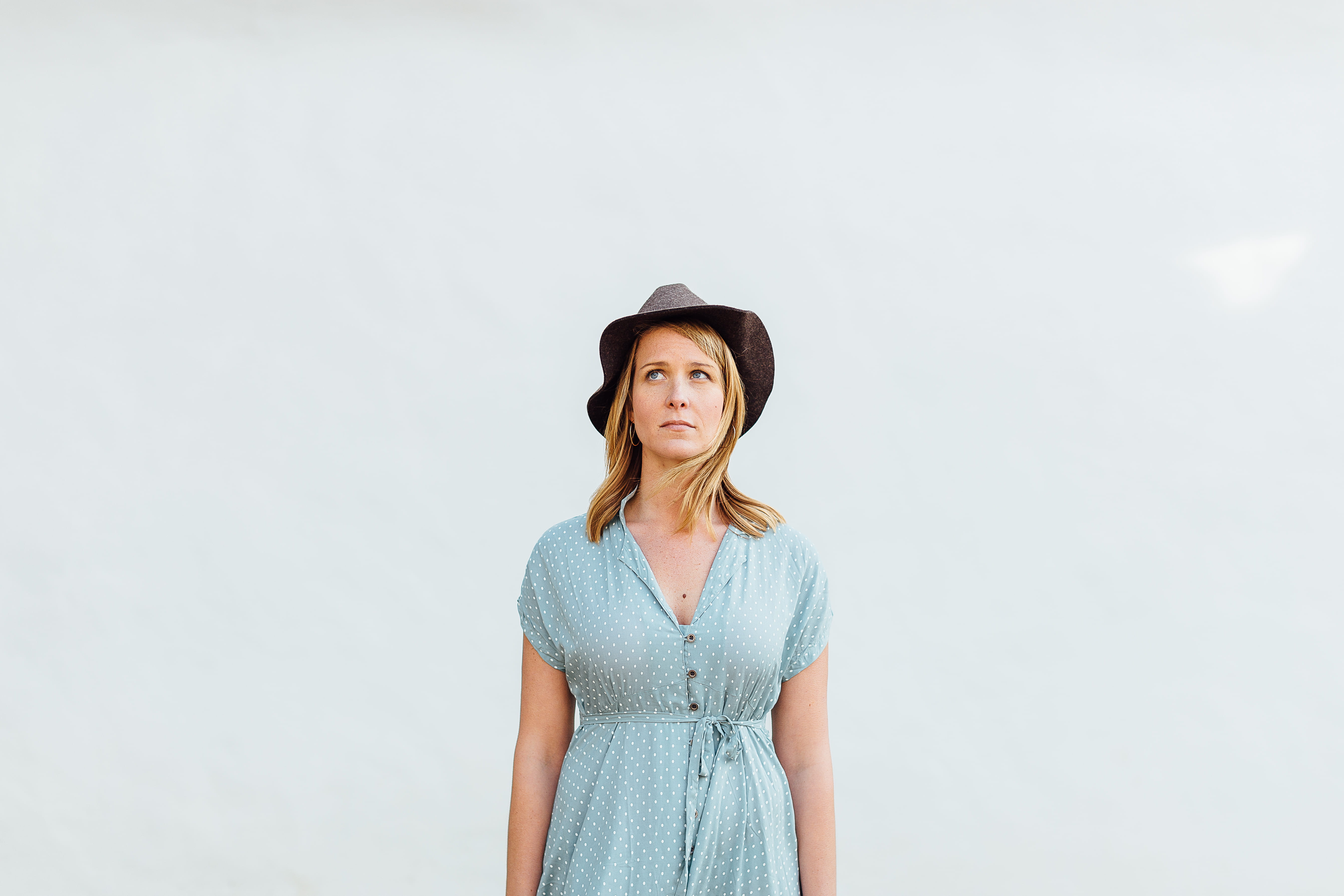 casual clothing, smiling, blue, hat, girl, looking at camera, portrait, sky, woman, front view, eyes, copy space, person, hairstyle, s, mid adult, white background, HD Wallpaper