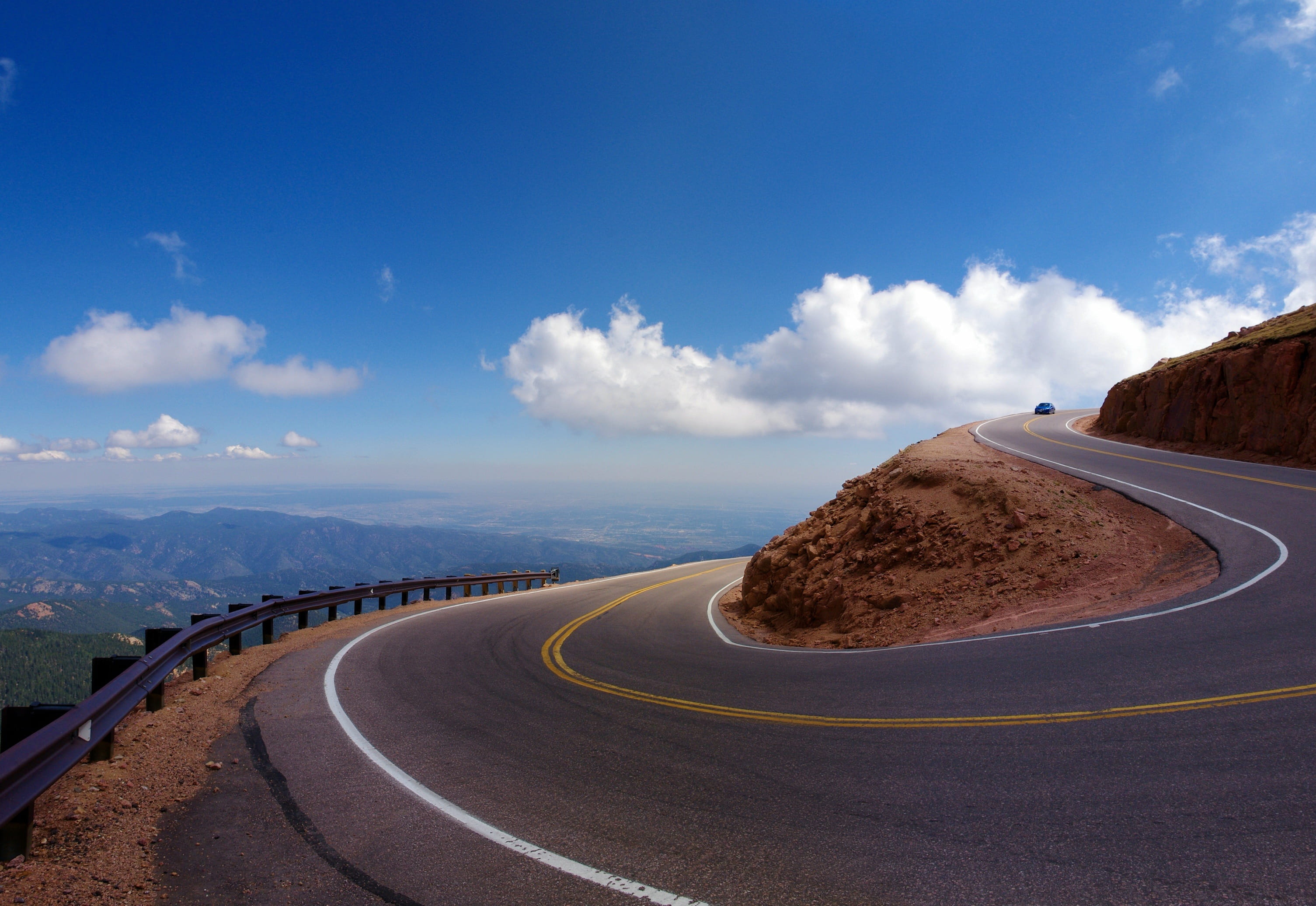 empty road, curve, cloud - sky, scenics - nature, hill, blue, symbol, clouds, pikes peak, scenic, transportation, no people, mountain road, environment, HD Wallpaper