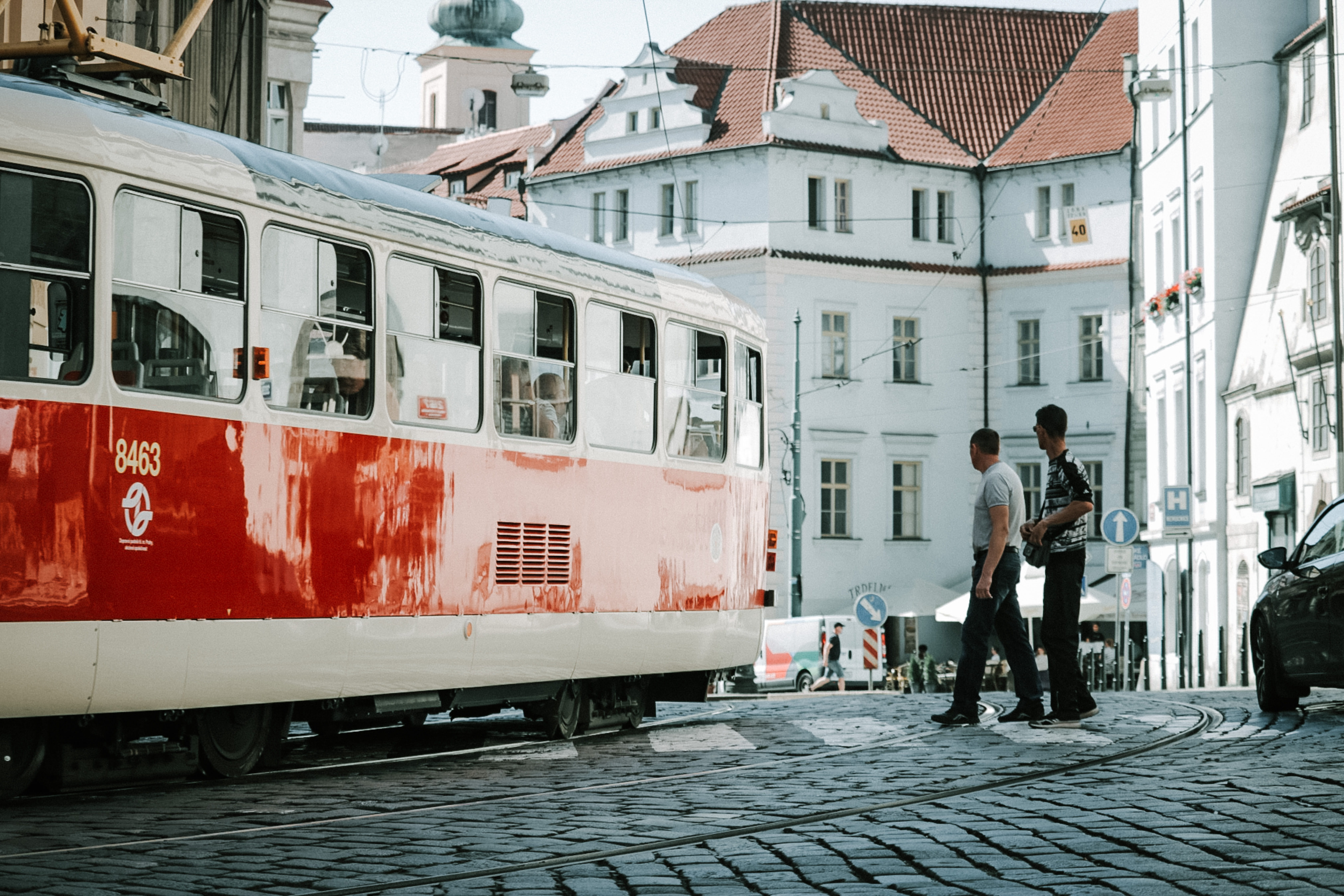 car, person, sky, tram lines, men, vehicle, train, machine, two people, modern, beside, cobblestone street, city, transportation, building exterior, rail transportation, HD Wallpaper
