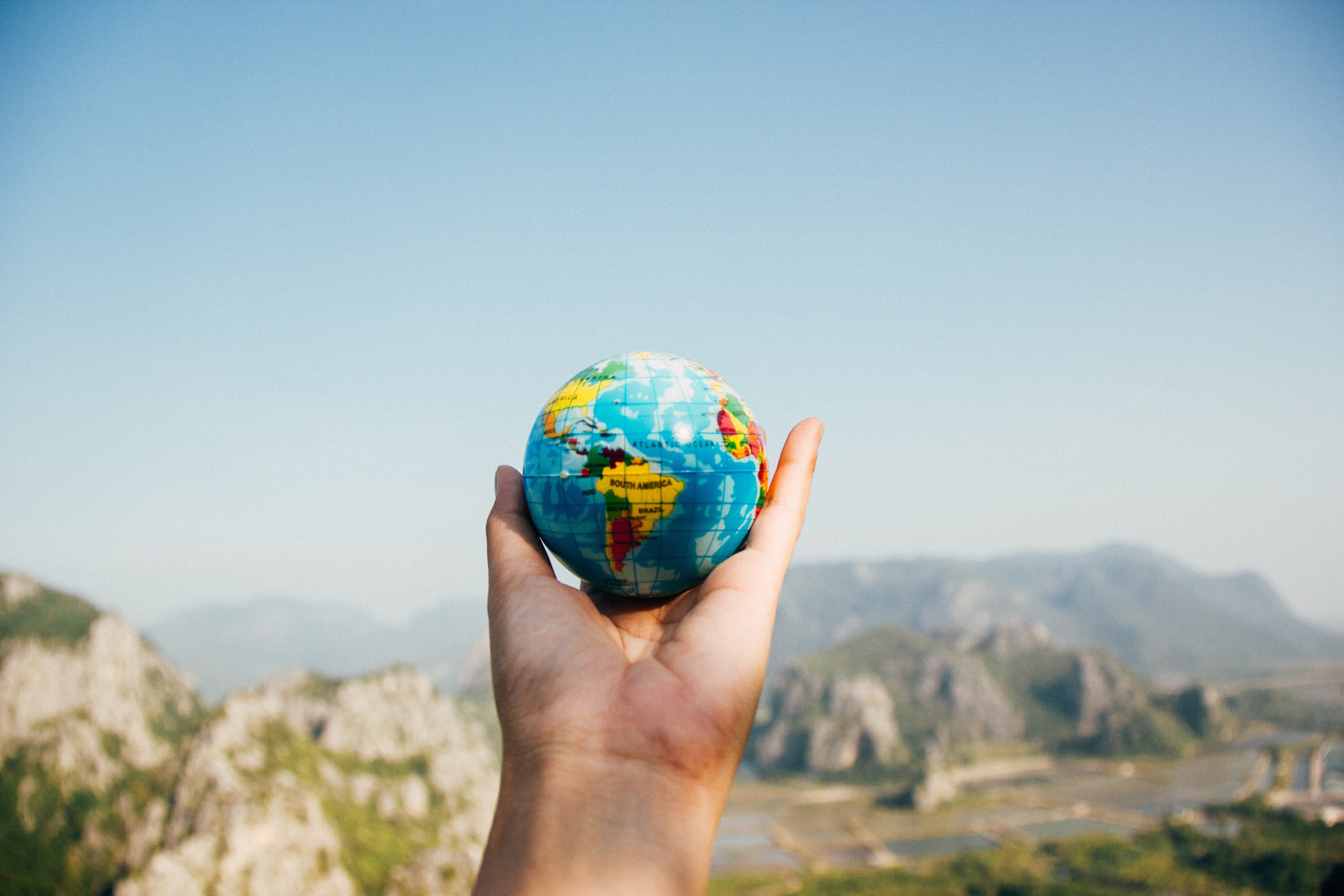 day, hand, one person, adult, globe - man made object, globes, 5K, outdoors, blue, hands, human limb, nature, sky, mountains, human arm, mountain, copy space, HD Wallpaper