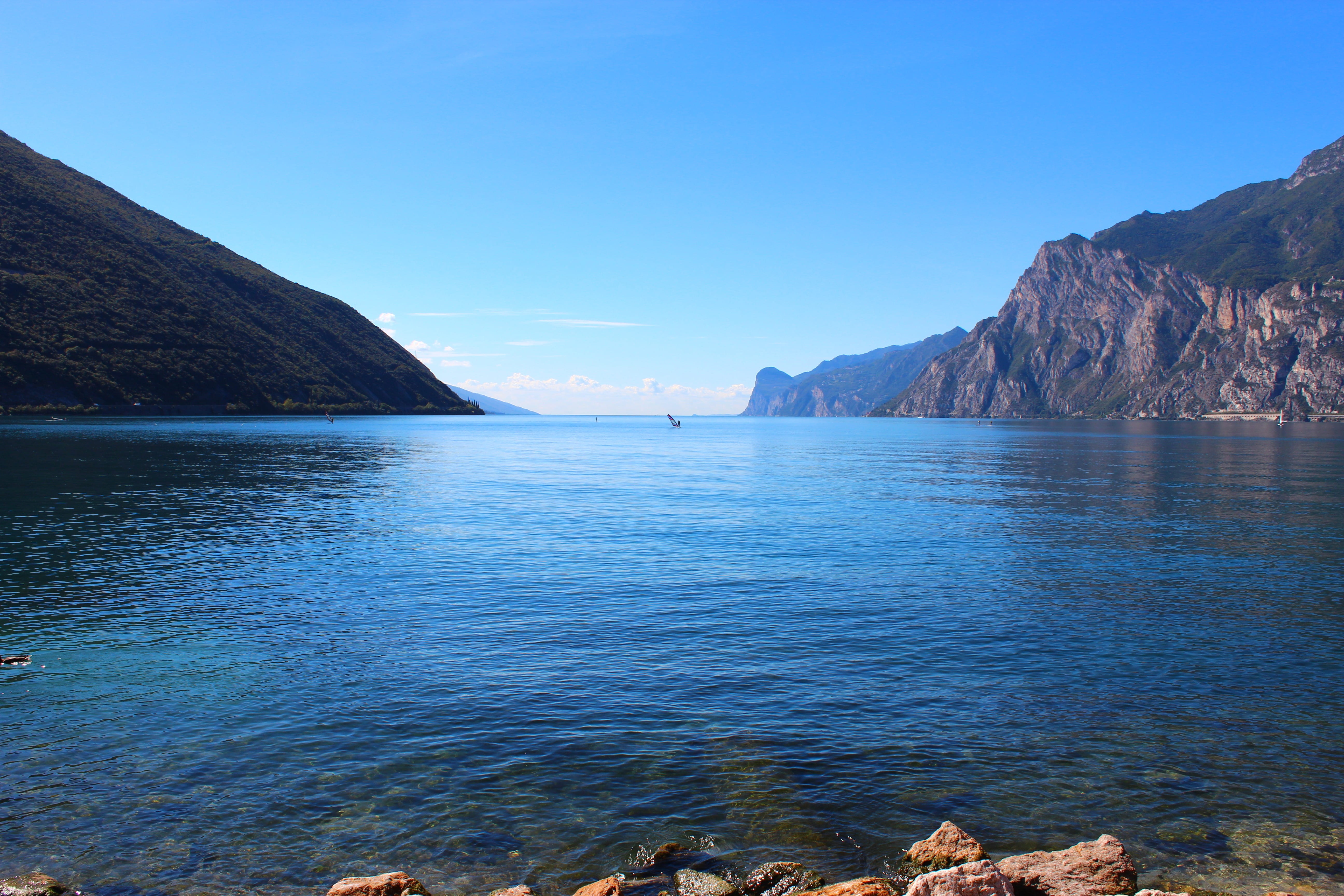 lake, riva, water, solid, land, panorama, mountains, tranquil scene, torbole, beach, garda, environment, sky, rock - object, mountain, nature, body, outdoors, HD Wallpaper