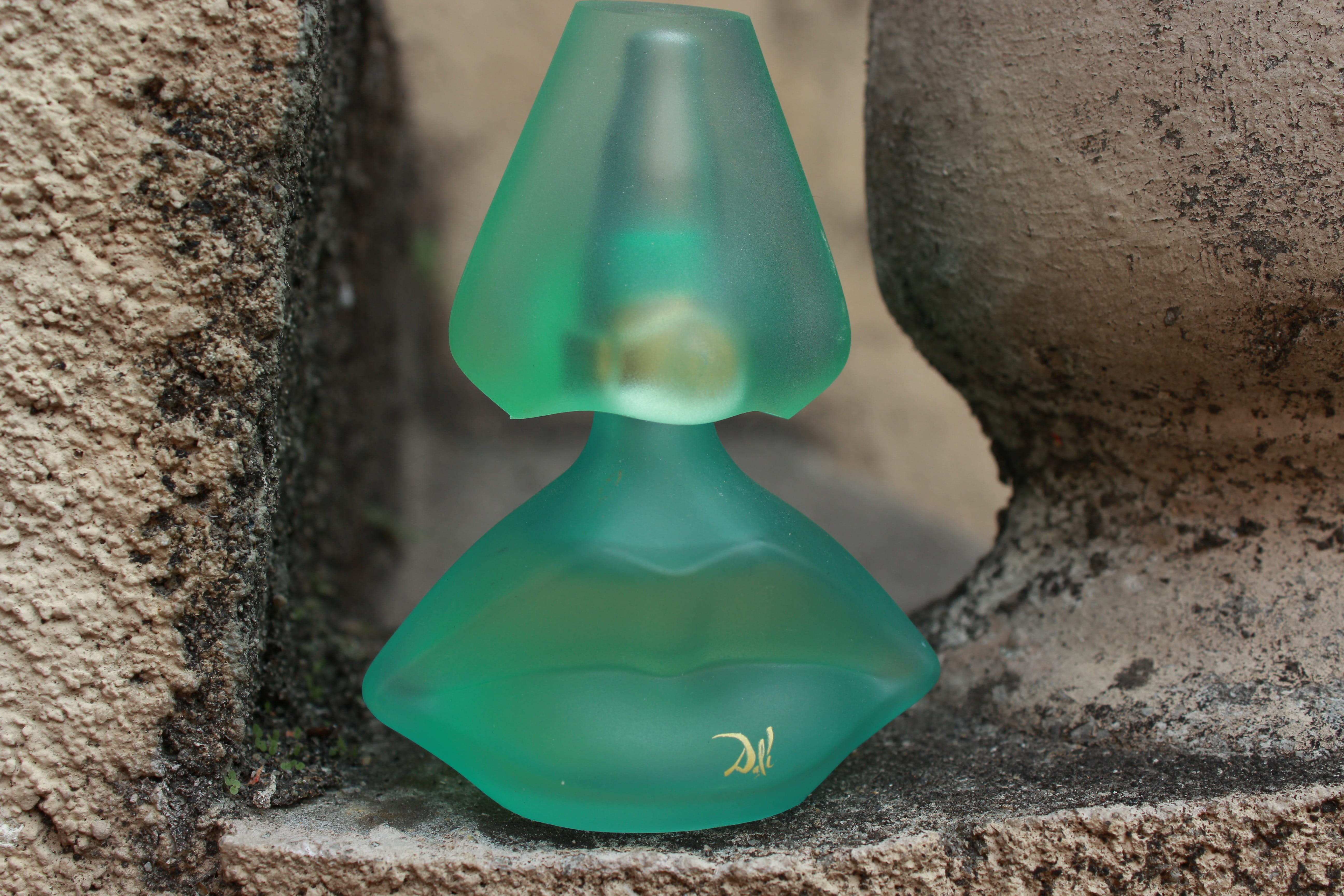 Bottle, rock, Salvador Dali, no people, textured, Perfume, single object, nature, wall - building feature, architecture, rock - object, solid, outdoors, HD Wallpaper