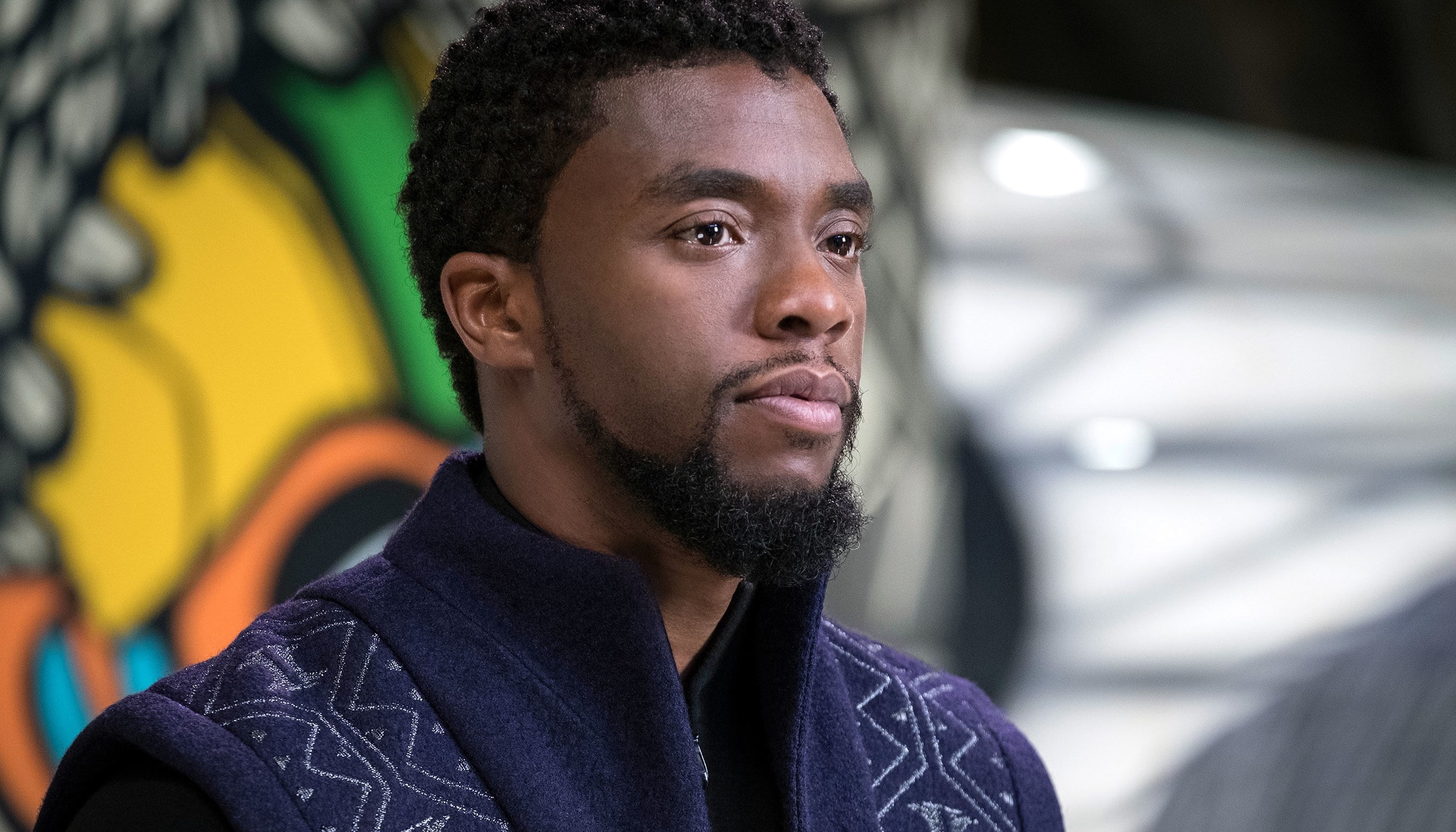 headshot, young adult, architecture, curly hair, boseman, front view, focus on foreground, 2K, one person, close-up, contemplation, serious, incidental people, HD Wallpaper