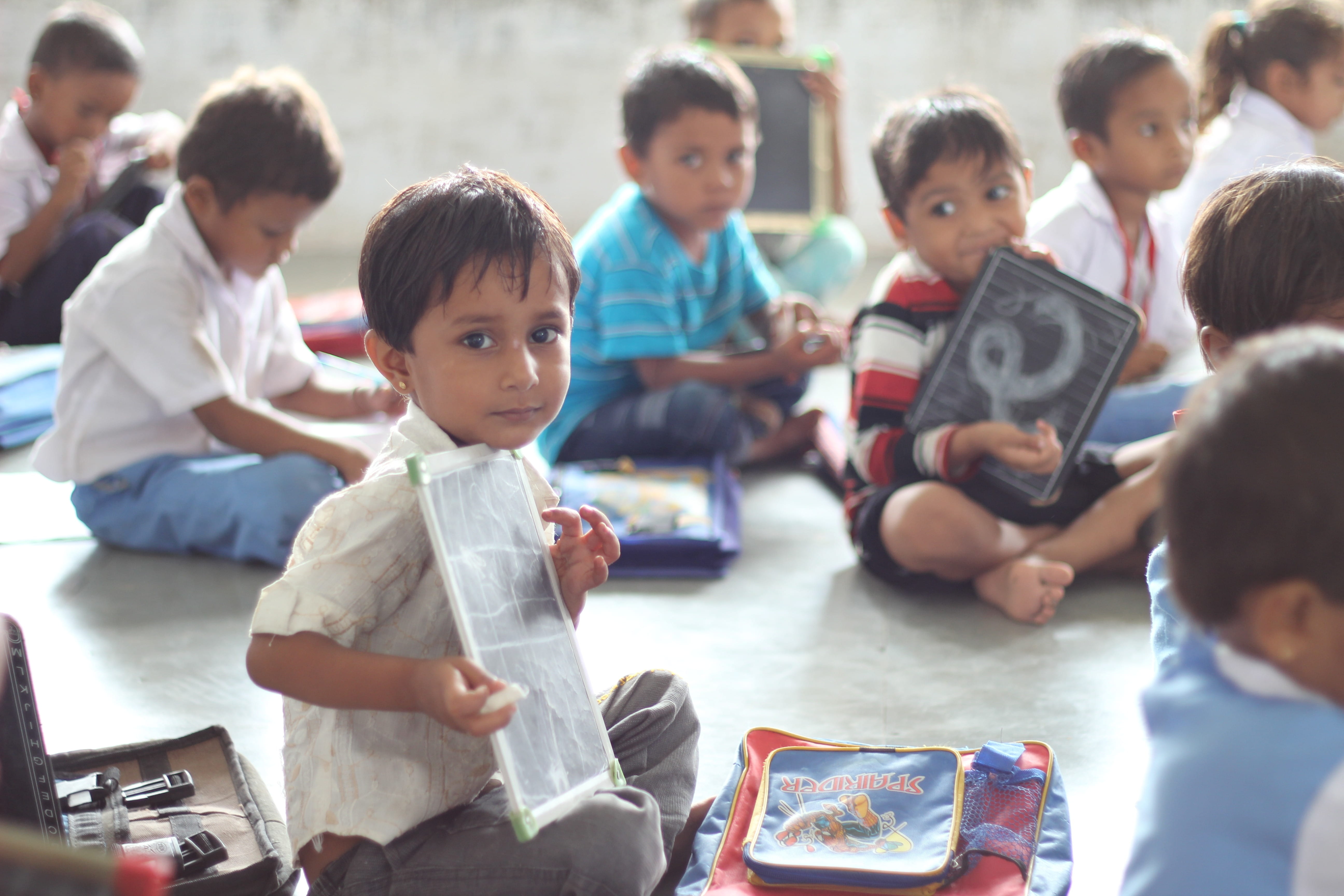 group of people, sitting, childhood, 5K, innocence, medium group of people, group, india, poor, kids, ahmedabad, children, holding, females, men, school, HD Wallpaper