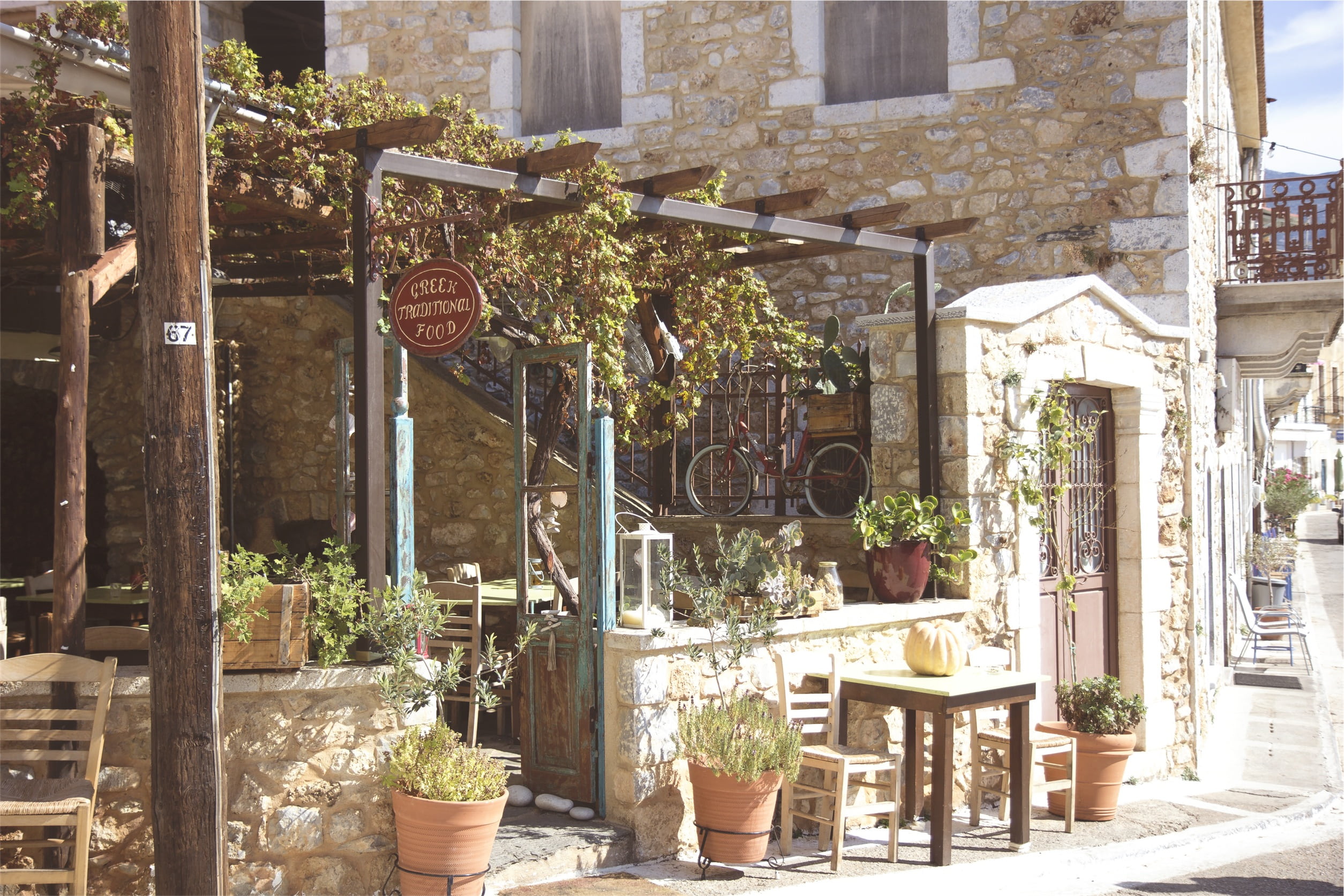 courtyard, greek, cafe, gray, building exterior, tables, outdoors, seat, chair, restaurant, text, lantern, potted plant, concrete, chairs, fence, plant, HD Wallpaper