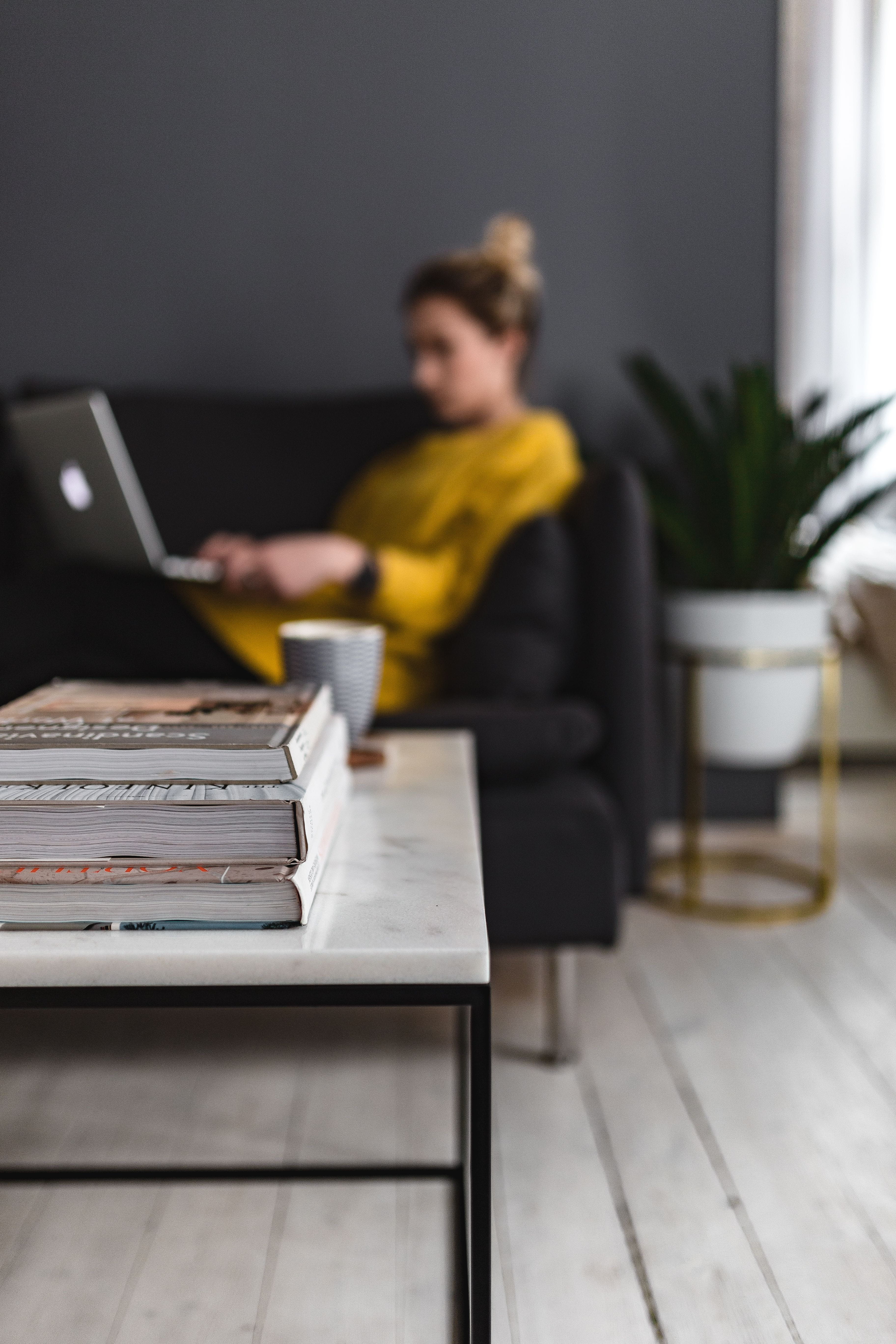 wireless Technology, couch, sitting, macbook pro, blonde, mid adult, sofa, marble table, scandi, typing, wooden floor, computer, woman, businesswoman, girl, Phone HD Wallpaper