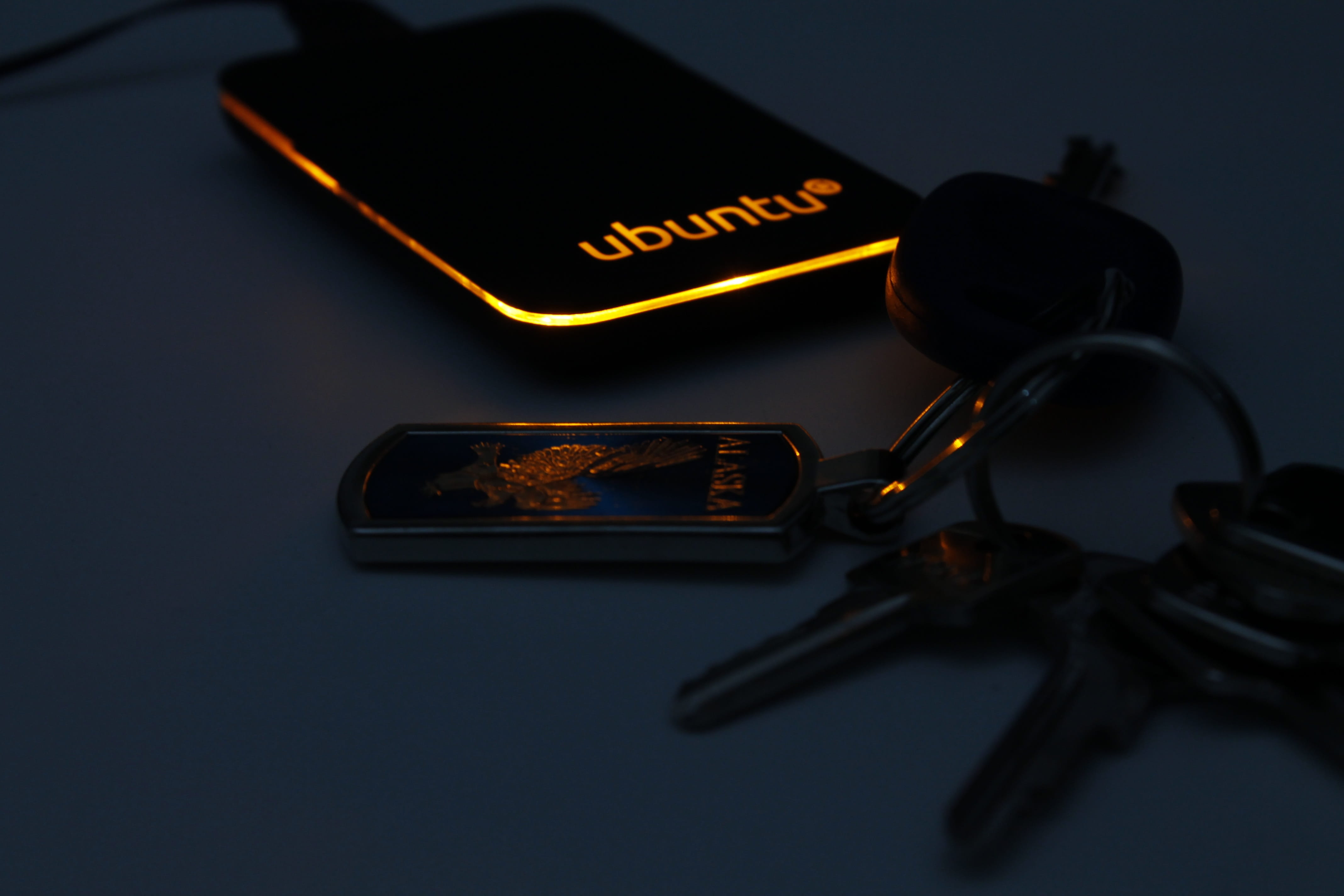 dark, selective focus, safety, close-up, pen, keys, Computer, no people, still life, Keys, table, key, indoors, western script, day, 4K, smart phone, high angle view, HD Wallpaper